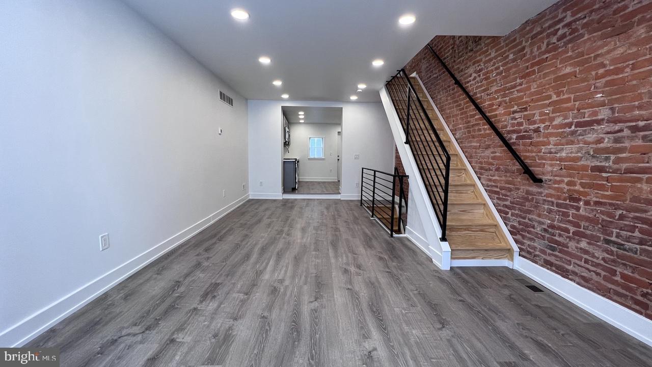Recently renovated and move-in ready, this charming 3‑bedroom, 1.5‑bathroom rowhome offers 800 sq ft of thoughtfully updated living space with exposed brick, luxury vinyl plank flooring, and sleek iron railings throughout.
Key Features: