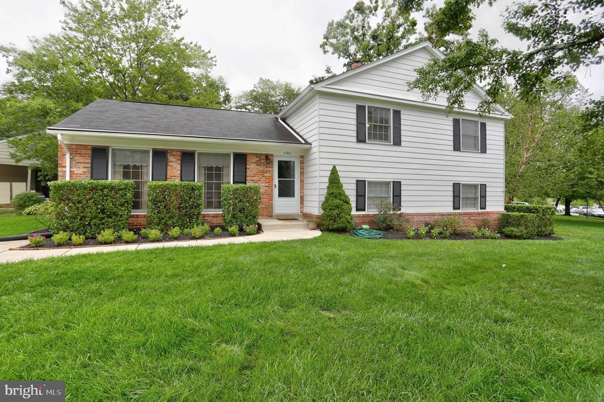 Welcome home to a charming 4-Level Split home that has been meticulously maintained and nestled on a beautifully landscaped corner lot. This spacious and inviting home boasts numerous upgrades, including new carpet and fresh paint throughout. As you approach this lovely property, you'll be greeted by its enchanting landscaping that adds to the home's curb appeal. The corner lot provides ample outdoor space, offering endless possibilities for gardening, play, or relaxation. A concrete patio, accessible through new sliding doors, is perfect for outdoor gatherings or quiet evenings under the stars.  The main level is graced with gleaming hardwood floors in the foyer, providing an elegant entrance. The living room and dining room are newly carpeted, creating a cozy atmosphere. The spacious table space kitchen is equipped with a gas range, making meal preparation a breeze. Upstairs, you'll find four bedrooms & 2 full bathrooms. The owner's suite features a private full bathroom, adding a touch of luxury to your daily routine.  The first lower level of this home offers a convenient half bathroom, making it ideal for guests. The large carpeted family room boasts a brick wood-burning fireplace, perfect for cozy winter nights. New sliding doors lead to the concrete patio, seamlessly connecting indoor and outdoor living. A spacious laundry/storage room with an exit door and a recently installed new furnace add functionality and efficiency to this level. The second lower level is a fantastic space for recreation and entertainment. With plank vinyl flooring and ample room for activities, this space is versatile and can easily accommodate a pool table or other hobbies. Don't miss the opportunity to make this your new home sweet home.