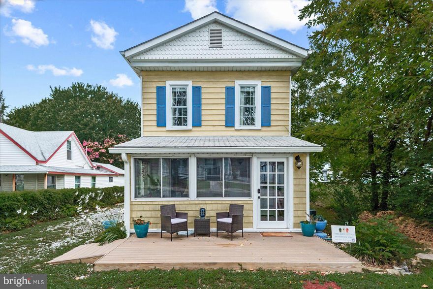 Welcome to this beautifully updated two-story cottage, brimming with timeless character and thoughtfully modernized for today’s lifestyle. From the front patio and inviting enclosed front porch to the freshly remodeled interiors, this home effortlessly blends Colonial Beach charm with contemporary comfort.
Step inside to a light-filled main level featuring shiplap ceilings, colonial moldings, and gleaming new flooring throughout. Fresh paint enhances the airy feel, while built-ins in the dining room add both function and charm. The open yet distinct living and dining spaces create a seamless flow, perfect for gatherings and everyday living. A cozy country kitchen boasts a brand-new stove and refrigerator, ready for your food prep and entertaining needs.
The main level also offers a bedroom and full bath, laundry area, and an additional flexible living space—ideal for a sunroom, office, or den. Upstairs, you’ll find three spacious bedrooms and another full bath, providing room for family and guests.
Outdoors is where this property shines. A large fenced-in backyard provides privacy and room to relax or play. Enjoy evenings around the fire pit area, a picnic under the covered carport, and store your beach gear in two storage sheds.
Currently operating as a successful Airbnb, this property is being sold fully furnished (with just a few family pieces excluded), making it truly turnkey for investors or those seeking a move-in ready retreat.
Located just blocks from the Potomac River, this home places you in the heart of Colonial Beach living—where golf carts, community charm, and waterfront sunsets are a way of life.

📍 Highlights:
Enclosed front porch
Remodeled main level with shiplap ceilings, new flooring & fresh paint
Open yet defined living & dining with charming built-ins
Country kitchen with new stove & refrigerator
Main-level bedroom & full bath, plus laundry and flexible living area
Upstairs: 3 additional bedrooms + 1 full bath
Large fenced backyard with fire pit area
Two storage sheds + covered carport
Offered fully furnished, currently a successful Airbnb
Quintessential cottage lifestyle just blocks from the river