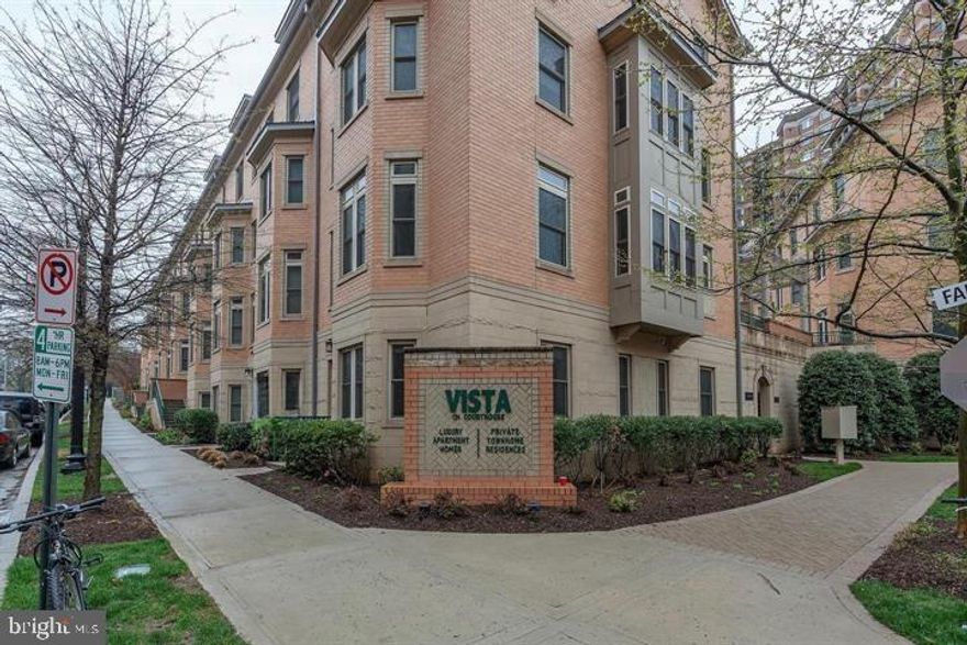 Just Listed & Open Saturday 1/24 12-2pm
Welcome to The Vista on Courthouse — where modern design meets timeless comfort with an A+ location.
This beautiful and light-filled 4-bedroom, 2.5-bath, 2775 sqft town home is tucked within one of Arlington’s most sought-after communities. The Vista offers the perfect blend of contemporary architecture, designer finishes, and a versatile four-level layout thoughtfully crafted for today’s lifestyle in a pretty tree-lined community. A refined brick exterior and a beautifully landscaped courtyard create a warm welcome for you and your guests.
Inside, the entry level features convenient garage access, a flexible bonus room ideal for a home office, den, or guest suite, and ample storage space to keep everything organized.
On the main level, discover a sophisticated formal living room with floor-to-ceiling windows and a cozy fireplace that opens to a modern dining room. The updated kitchen is a true showpiece, complete with granite countertops, a spacious island with new pendant lighting, upgraded stainless-steel appliances including a gas range and vented hood, dark wood cabinets with honed black hardware and a designer tile backsplash. Just off the kitchen, a charming breakfast nook with French doors that open to a private fenced patio—perfect for relaxing or entertaining outdoors. A powder room completes this level.
The primary suite on the third level offers a serene retreat, featuring a custom walk-in closet and a spa-inspired bath with dual vanities, a soaking tub, and a frameless glass shower. A conveniently located laundry closet adds ease to everyday living.
The top floor includes two spacious bedrooms—each with walk-in closets—and a shared dual-entry bath with a separate vanity area.
Additional highlights include a two-car garage, hardwood floors on the main level, new carpet in the primary suite, updated lighting throughout, fresh designer paint, custom window treatments, and 10’ ceilings that enhance the home’s open, airy feel.
Ideally situated directly across from Rocky Run Park, you’ll enjoy outdoor recreation right outside your door. Commuters will appreciate easy access to I-66, Routes 50 and 29, and the Clarendon and Courthouse Metro stations, putting Arlington’s best restaurants, shops, and cafes just moments away — including Trader Joe’s, Crate & Barrel, Williams Sonoma, Tatte Café, and Whole Foods.
Residents of The Vista on Courthouse also have access to premium amenities including a pool, fitness center, club room, and business lounge. The community has plenty of guest parking along 12th Ct and Fairfax Dr.