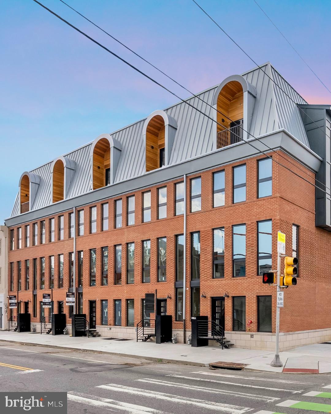 Introducing "10 on Eleventh" - a stunning new community, comprised of ten luxury homes ideally situated at the corner of Christian Street and 11th Street in the highly desirable Bella Vista neighborhood of Philadelphia. A premier Philadelphia based Development firm, Hightop thoughtfully designed these homes to offer over 3,200 square feet of refined living space featuring 4 bedrooms, 4 full bathrooms, 2 half bathrooms, 2-car GARAGE parking, private ELEVATOR and expansive private rooftop decks. Every detail has been thoughtfully considered—from the sleek, modern design to the premium finishes and smart layout. Step inside to find a welcoming entryway that leads to a full bedroom and bathroom on the first level, ideal for guests, an office, or a private suite. Upstairs, the main living level impresses with wide-plank hardwood floors, recessed lighting, and an open-concept layout perfect for everyday living and entertaining. Massive windows throughout let exceptional southern light into the home. The gourmet kitchen features high-end custom cabinetry, stainless steel appliances, quartz countertops, a large island with barstool seating, and a designated dining area. A stylish powder room is tucked conveniently off the kitchen, just before the spacious living room that anchors the main level. The luxurious owner’s suite boasts large windows for abundant natural light, a walk-in closet with custom shelving, and an elegant bathroom complete with dual vanities, a soaking tub, a linen closet, and a spacious walk-in shower with a rainfall showerhead. Two additional bedrooms—each with their own private bathrooms and generous closet space—round out the upper floors. Before heading to the rooftop, you’ll pass a sleek wet bar perfect to entertain your company. The private rooftop terrace offers ample space for dining, lounging, or even a hot tub—perfect for relaxing or entertaining. A finished basement adds valuable bonus space and includes a half bathroom. Each home includes a 10-year property tax abatement and a 1-year builder’s warranty. Located in the heart of Bella Vista, residents will enjoy easy access to some of Philadelphia’s best amenities. Stroll through the historic Italian Market, grab coffee at Fitzwater Café, or enjoy dinner at Dante & Luigi’s or The Saloon. South Street’s shops, bars, and restaurants are just around the corner, while Center City, Washington Square West, and Old City are all within walking distance. With convenient access to major highways and public transit, getting around the city is effortless. Taxes are not $1. Taxes and square footage is the responsibility of the buyer to have verified independently. Association fees are not $1 and are TBD. Photos are of the model home and may not depict actual finishes.