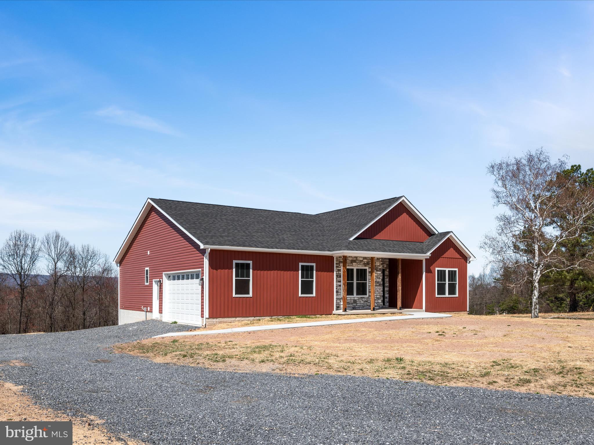FOUR GARAGE SPACES . . . Your dream home with a view is ready and waiting! You can have the privacy and space of the country and be just 7 miles from Route 522, 16 miles to downtown Berkeley Springs, 25 miles to Winchester and 23 miles to Hancock. What are you waiting for? This stunning NEW rancher boasts 3 spacious bedrooms and 2.5 luxurious baths, offering the perfect blend of comfort and style. Step inside to discover an open-concept living area flooded with natural light, ideal for entertaining or cozy family nights. The chef’s kitchen features top-of-the-line appliances and a generous island. Downstairs, an expansive unfinished basement awaits your personal touch – perfect for a home gym, media room, or additional living space. Car enthusiasts and hobbyists will appreciate the two-car attached garage, as well as an additional two-car detached garage. Enjoy outdoor living year-round on the spacious, maintenance free, covered back deck, perfect for relaxing and entertaining with a view. Nestled in a serene neighborhood, this home is a rare find that combines modern living with ample space for all your needs. The builder has even included a privacy fence and water softener. Don't miss your chance to call this exceptional property your own!