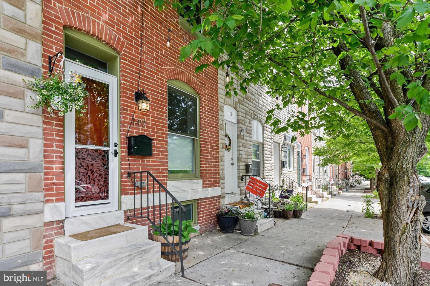 This charming Patterson Park rowhome boasts 3 bedrooms, 2 full baths, a Rooftop Deck AND Parking.  The main level features beautiful hardwood floors, exposed brick, an updated kitchen with granite counters, a stylish ceramic tile backsplash, stainless appliances, recessed lighting, a gorgeous center island and access to a deck with a sitting area. The second floor offers 2 bedrooms, a full bath, hardwood floors, exposed brick and access to the roofdeck. The finished basement offers a rec room/third bedroom with a private full bathroom + laundry area.  Walk to Patterson Park, 111 acres well known for its green space, large  trees, paved walkways, historic battle sites, lakes, playgrounds, athletic fields, swimming pool and the Patterson Park Pagoda.