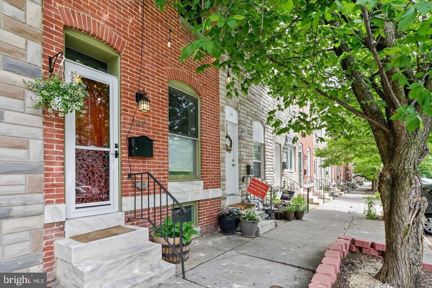 This charming Patterson Park rowhome boasts 3 bedrooms, 2 full baths, a Rooftop Deck AND Parking.  The main level features beautiful hardwood floors, exposed brick, an updated kitchen with granite counters, a stylish ceramic tile backsplash, stainless appliances, recessed lighting, a gorgeous center island and access to a deck with a sitting area. The second floor offers 2 bedrooms, a full bath, hardwood floors, exposed brick and access to the roofdeck. The finished basement offers a rec room/third bedroom with a private full bathroom + laundry area.  Walk to Patterson Park, 111 acres well known for its green space, large  trees, paved walkways, historic battle sites, lakes, playgrounds, athletic fields, swimming pool and the Patterson Park Pagoda.