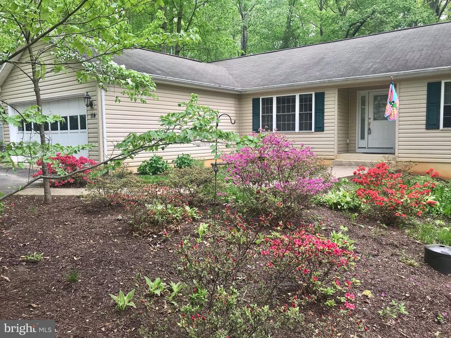 ***New Price***This Wonderful and Well taken care of 3 bdrm 2 bath home with Split Floor Plan opens up to nature! The Sun filled living room has vaulted ceilings andFrench Doors that lead out to a huge private deck overlooking trees. The Master bedroom also walks out to the private deck! Gorgeous eat in Kitchen with ceramic flooring, Corian Counter tops and upgraded cabinets! Bay Window overlooks beautiful view of trees out back! Tons of Storage! HVAC & Hot Water Heater replaced in  2016. The large 2 car garage has a workbench, shelves and cabinets! This home has what you need in a private gated neighborhood that has it all!