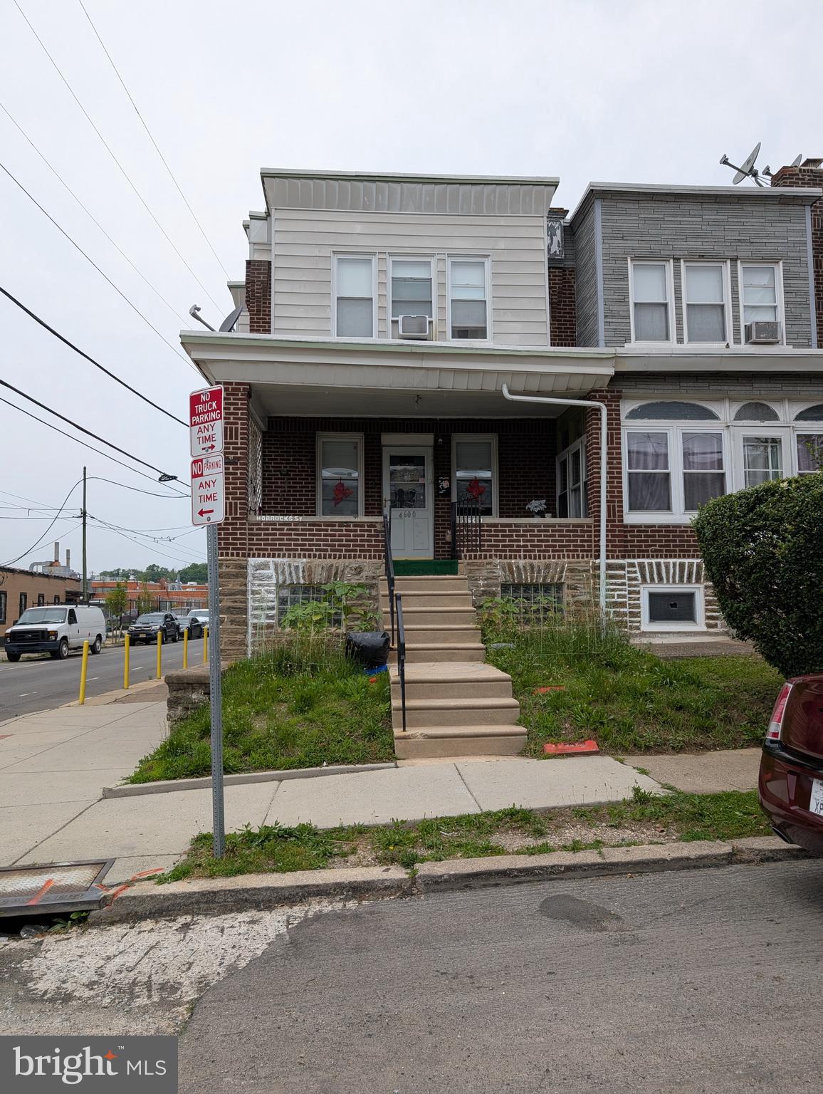 This end townhouse offers a unique opportunity. The lower level has been used as a plumbing business; it offers a large office area, storage, and a full bath. The house offers a covered front porch, a large living room, a formal dining room, a bonus space, and a galley kitchen. The second floor offers four bedrooms and a full bath. Keep it as is, or open up the house to the basement level and have a large home.