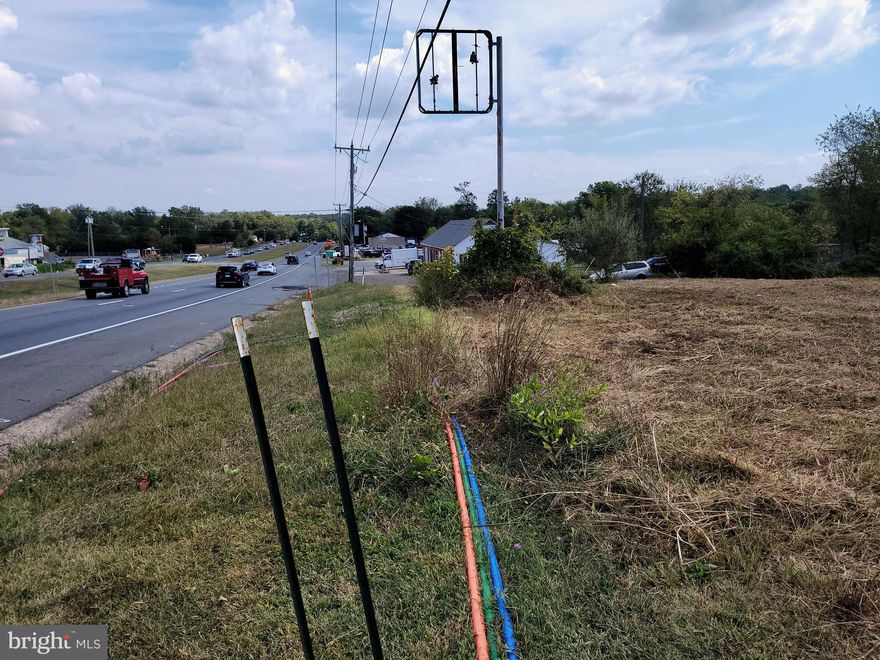 3.1 Acres zoned I1  (INDUSTRIAL).  Hard to find Industrial land fronting Rt 29 just on the south edge of Gainesville at the county line.  Property is in Fauquier County.  The address number listed is the neighbor's address because this property is land only. Please see photos.  Site plan has not received final approval yet.  VDOT owns enough right of way for turn lane to be installed for entrance. Possible shared entrance with neighboring property at buyer's cost. Small pond area in the back of the property will make storm water management easier.  Call listing Broker for more info. Additional 3.3 Acres could be added to sale for additional price..