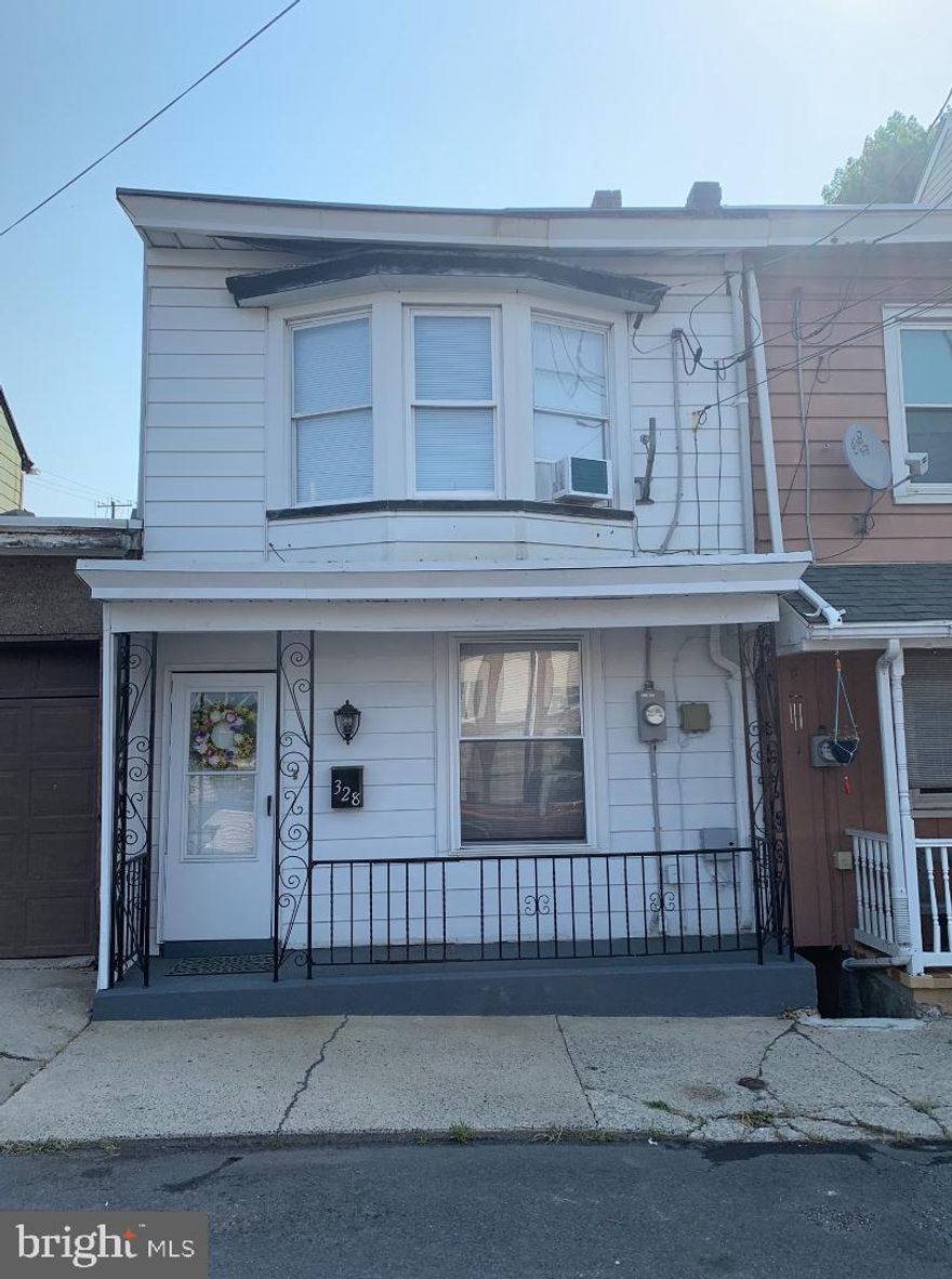 Back on the market due to buyer financing.  Freshly updated and ready to move in.  Living room /dining combination with plenty of living space.  Kitchen has newer cabinets and back splash with convenient washer dryer right there.  There is also a half bath on the first floor.  Second floor has 3 private bedrooms .  The front bedroom has plenty of natural light and a large closet with built in shelves on both sides.  Bathroom has tub and shower with new vanity.   The attic is finished with heat and can be used as a possible 4th bedroom.   There is a covered porch and nice size yard for plenty of outdoor entertaining.  Most windows have been replaced.  Appliances are included.   200 amp service added in 2022.  Just down the street from the Laurel and 12th St bus stop.  come back this your new home for 2024.