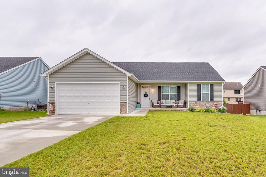 Step into this beautiful rancher located in the Princeton Shoals community of Martinsburg, WV. This charming home offers the convenience of main-level living with a spacious open-concept floor plan that seamlessly connects the kitchen, dining area, and family room—perfect for everyday living and entertaining.

Featuring 3 bedrooms, 2 full baths, and a 2-car garage, this home provides both functionality and comfort. The upgraded kitchen is the heart of the home, showcasing granite countertops, stainless steel appliances, upgraded cabinetry, and a large center island ideal for prep and gathering.

The primary suite is thoughtfully positioned on the opposite side of the home for added privacy, and includes a walk-in closet and a private en-suite bath with a walk-in shower. Two additional bedrooms and a full hall bath are also conveniently located on the main level.

Enjoy outdoor living with a covered front porch, fenced backyard, and a rear deck, perfect for relaxing or entertaining.

Located just minutes from Rt. 11 and I-81, this home offers a prime commuter location with easy access to shopping, dining, and local amenities.
 Don’t miss this move-in-ready gem—schedule your private tour today!