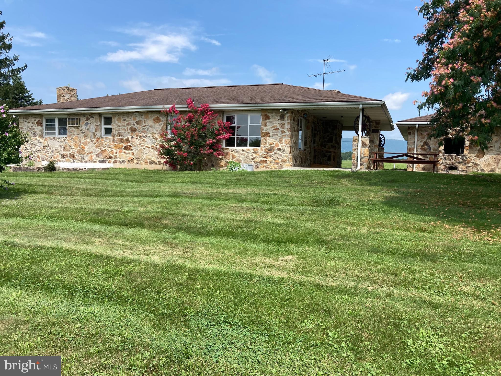 One OF ITS KIND, Beautiful Mountain and Valley Views, Mountain stone rancher house with full basement, 2 car detached garage w/new doors, private setting, porch, outside basement entrance, Kitchen is 13x16, Dinning area is 13x16, Living is 16x23 with a fireplace and a door to go out front, Bath is remolded, 1st bedroom is 7x12, Master bedroom is 14x12 has a walk in closet and a walk in shower, The walk in closet is 6x8 and has a safe in it attached to the wall, The master bath is 6x9, The 2nd bedroom is 10x16 with a double closet, The den in basement is 21x15 and is finished, workshop is 46x16 and is not finished Garage is 24x32, There is a side door to go into the garage, Utility room is 12x16. The Utility does have a washer/ dryer in it along with wood stove, There is a fence post for a play yard, furnace is less than five years old, newer roof, and there are 3 zones,