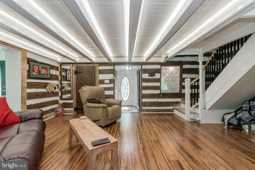 Future Home & Land Owners, look at all the opportunities offered at 1375 Tub Run Hollow Road! With the ability to tie into the existing extra utilities on the property, you can have extra rental income tomorrow or a shop for all your toys or projects. This 100% completely renovated home offers unparalleled flexibility to accommodate your unique needs and preferences. Whether you're looking for a personal residence, a potential rental investment, and/or a site to build your dream home; this property has the potential to be the perfect canvas to bring your vision to life. Newly installed utilities, central AC/heat and updated electrical system to the smart lighting and overflow pans on the washer and hot water heater, absolutely every inch, inside and out, of this home has been thoughtfully designed and renovated to provide the ultimate in comfort, convenience, and peace of mind. The second bedroom on the main floor is a bit on the small side and could also be used for an office to. Due to the 1880’s log cabin design in just the main living room, if your over 6’-4” tall this house would not be for you because of the low ceiling design. You have no neighbors and plenty of quite privacy.