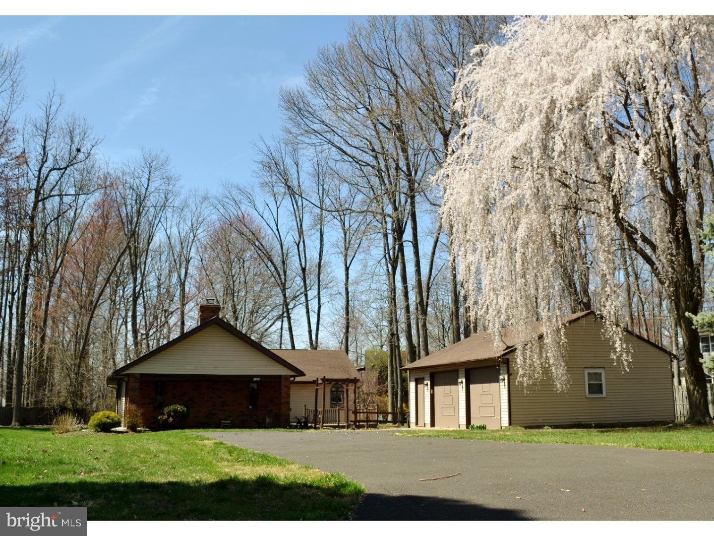 This spacious and sprawling ranch home with large detached 2+ car garage is now available in a tucked away neighborhood in Middletown Township and Neshaminy Schools. This is not a Levitt built home. Unique features of this home include cathedral ceilings and floor to ceiling brick fireplace in the living room. The large and bright kitchen has vaulted ceilings and is open to the large dining area. Sliders lead to a side deck off of the kitchen area making a great entertainment space. Large master bedroom is set apart from the 3 additional bedrooms and has his and hers closets, sliders leading to the back yard and private access to the bathroom with a Jacuzzi tub. This home is a blank canvas, freshly painted, newer flooring and is move-in ready. Location is convenient to numerous shops, restaurants, schools and major roadways. Turn the key and make this home your own!!