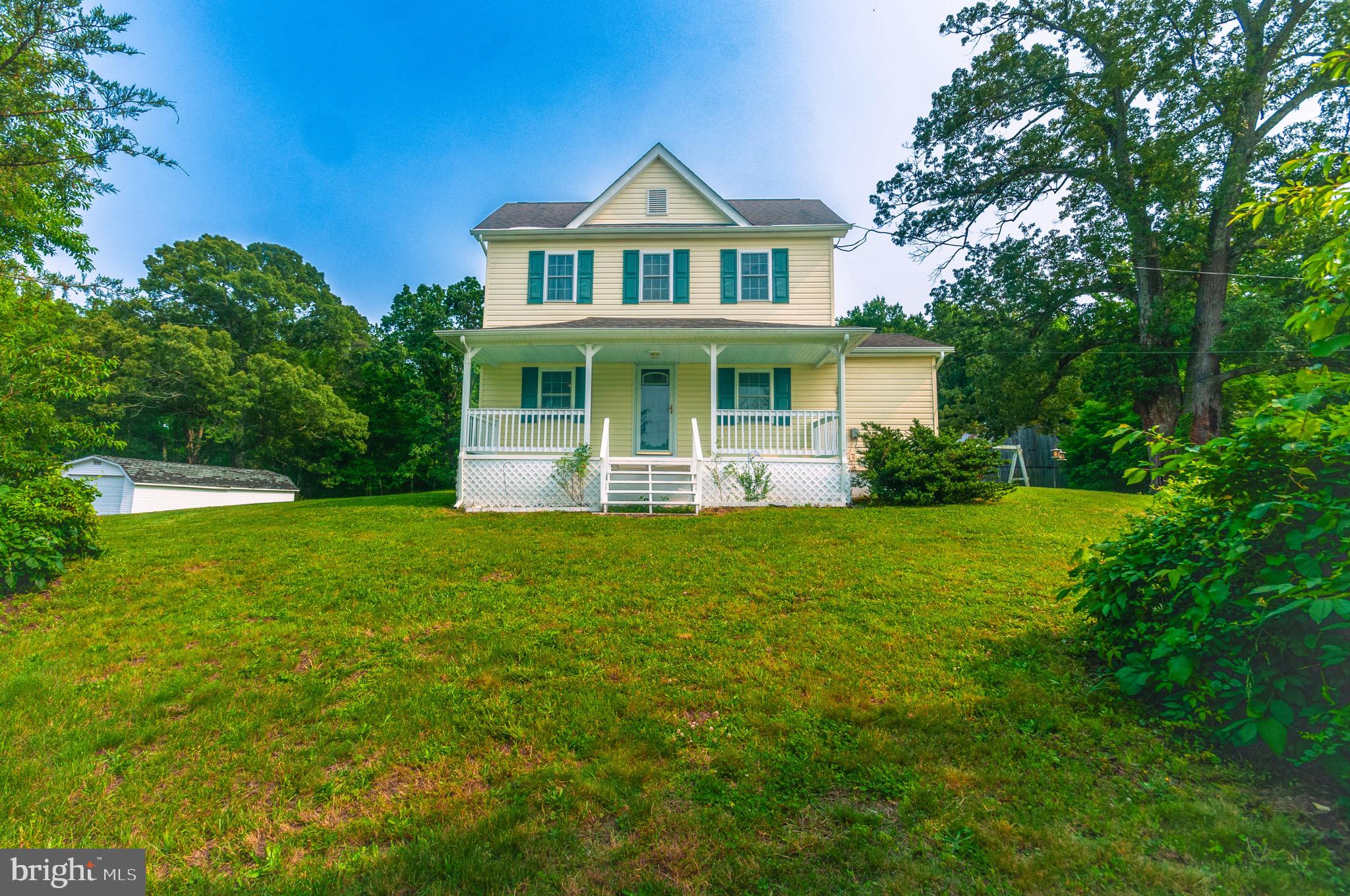 OPEN HOUSE JULY 26 - NOON - 2PM
Welcome home to this nostalgic farmhouse in the heart of Hughesville set on 1.48 acres. NO HOA!
This home has solid bones with extensive renovation completed in 2014 to include beautiful kitchen cabinets, counters, windows, roof, HVAC, insulation & drywall. The front porch opens up to the living room with beautiful hardwood flooring. The kitchen area is spacious with a large island for preparation and additional storage. The large separate dining area is perfect for gathering around the table. There is a large laundry room/mudroom area off the kitchen that leads to the back patio. The main level also features the primary bedroom and full bath with additional closet space. Going up the hardwood staircase you will find two additional bedrooms with additional closet storage and lots of light. Just behind the home you will find a large barn with a workshop area and electric and an additional shed for even more storage. Convenient location to schools, shopping and commuter bus service into DC is 5 minutes away!