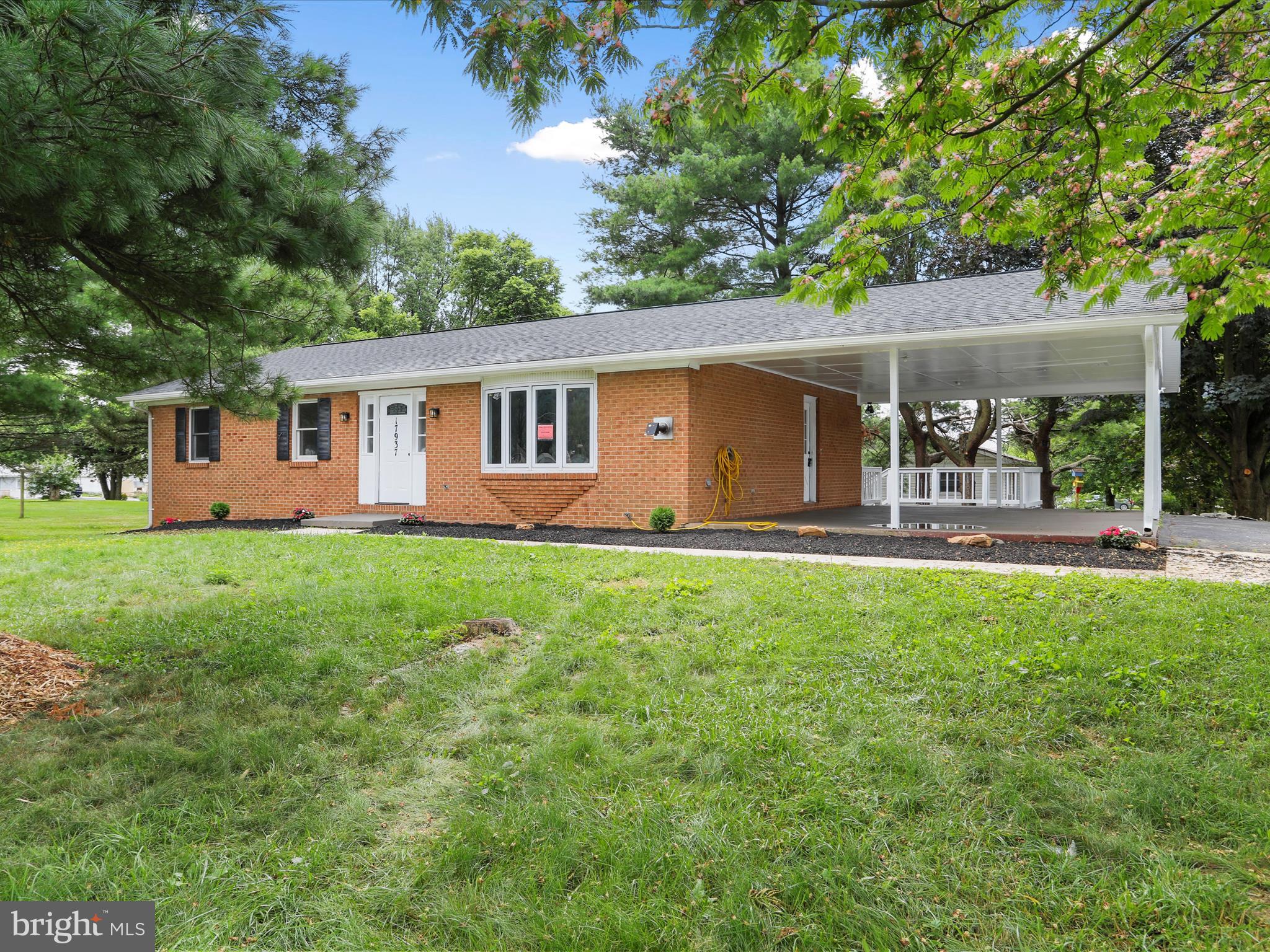 Welcome to 17937 Leona Ave, Maugansville, MD. This recently renovated home offers modern comfort and charm on a spacious 0.33-acre lot. This move-in-ready gem features 3 bedrooms, 2 full bathrooms, and a host of updates throughout. Step inside to discover brand-new luxury vinyl plank flooring, updated lighting, and a fresh, inviting atmosphere. The updated kitchen boasts sleek quartz countertops, modern cabinetry, and brand-new appliances, perfect for both everyday cooking and entertaining. Both bathrooms have been completely remodeled with custom-tiled showers, including the en suite. The cozy living space is complemented by a pellet stove, adding warmth and character for those chilly Maryland evenings. A brand-new HVAC system ensures year-round comfort and efficiency. Outside, enjoy a two-car carport that leads to a spacious deck overlooking the backyard, ideal for summer gatherings, gardening, or simply relaxing outdoors. Located in a quiet neighborhood with easy access to local amenities, this home blends comfort, style, and functionality. Don’t miss your chance to own this turnkey beauty in the heart of Maugansville!