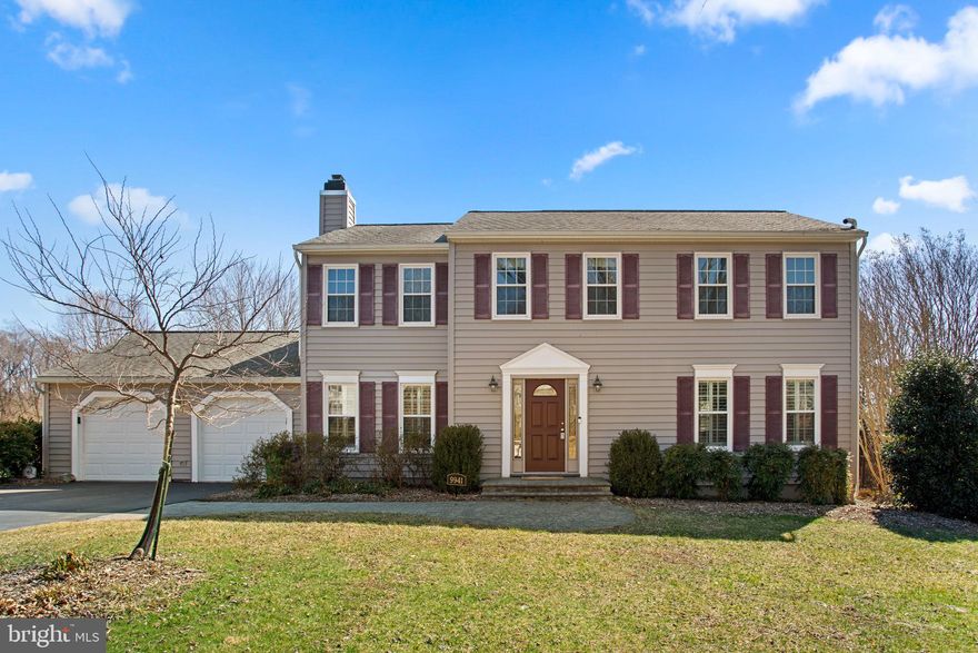 Nestled on a beautifully landscaped nearly half-acre lot in Font Hill Village, this charming 2,450 total square foot Colonial offers 4 bedrooms, 2 full baths, 1 half bath, and a 2-car garage, complete with solar panels for energy efficiency. Inside, hardwood floors and elegant crown molding enhance the traditional yet inviting main level. The foyer flows seamlessly into the living room and formal dining room, where a timeless chandelier adds a touch of sophistication. The hardwoods continue into the eat-in kitchen, which features stainless steel appliances, ample counter space, rich wood cabinetry—including see-through cabinets and open shelving— and a cozy breakfast nook. A sunlit great room impresses with high vaulted ceilings and exterior access. The family room exudes warmth with exposed wood beams, plush carpeting, and a gas fireplace. A convenient powder room and a laundry room with garage and deck access complete this level. 

Upstairs, the primary suite features hardwood floors, double closets, and a spa-like ensuite with two vanities, including a separate vanity area. The additional three bedrooms offer comfort with cozy carpeting and convenient access to the second full bath. The fully finished lower level expands the home’s versatility, offering a spacious recreation room, a bonus room that could serve as a fifth bedroom, complete with a walk-in closet, and ample storage. Step outside to a backyard retreat featuring a screened-in porch, an open composite deck, a stone patio, and a beautifully landscaped yard.