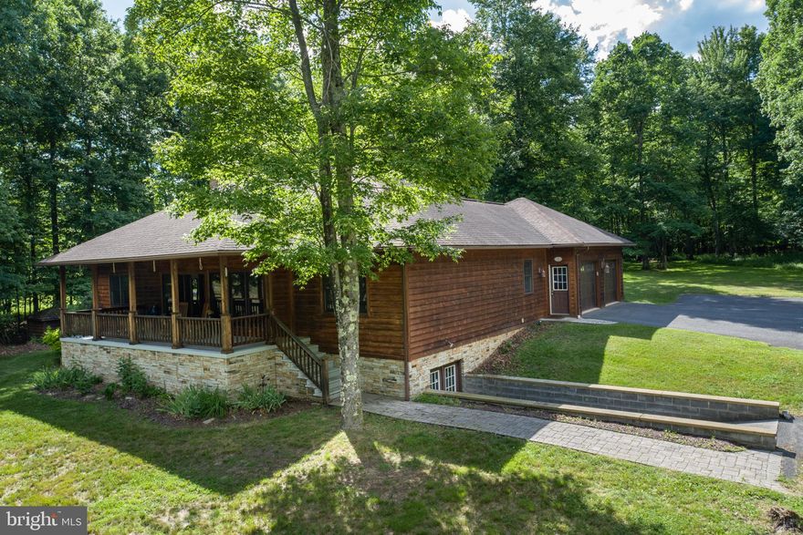 Beautiful Mountain Home nestled in the Hills of Western Maryland! Minutes to Swallow Falls and Deep Creek Lake, this 4Bed 2Bath Mountain Lodge sits on just over 4 Acres of wooded ground, offering supreme privacy, without feeling completely off the grid. Hardwoods and rustic features throughout, with all the modern comforts of home. Open concept living area surrounds the gorgeous stacked stone wood burning fireplace, keeping you cozy in the cold winter months. Charming covered front porch and back patio add a manicured space to relax amidst the shade of mature hardwoods and fresh mountain air. Oversized two car garage to keep your tools and toys out of the elements, with double door access to the walk out basement, providing vast amounts of climate controlled storage space. Additional finished living area in the lower level makes for a perfect recreation room to accommodate you and your guests on those rainy days or evenings in. Don’t miss your chance to see this Classic Four Season Mountain Retreat. Call today for your private showing!
