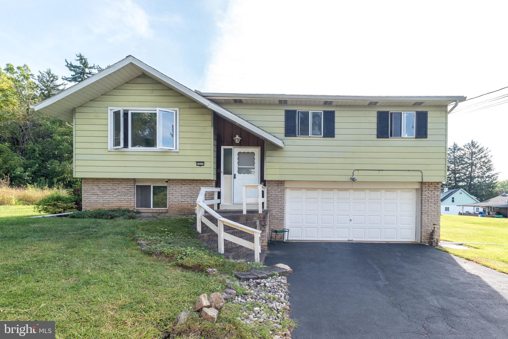 This charming 3-bedroom, 1.5-bath gem is tucked away at the end of a peaceful cul-de-sac, offering privacy and a large yard—perfect for entertaining, relaxing, gardening, or play. Inside, you'll love the open floor plan that seamlessly connects the spacious, sun-filled living room to the kitchen and dining areas—ideal for both everyday living and hosting. Step out onto the deck to enjoy a beautiful view, or head downstairs to the enormous lower-level family room featuring sliders that open to a patio—great for indoor-outdoor living. The attached two-car garage includes an automatic opener and a convenient side door for easy access. While this home could use a little TLC, it’s packed with potential and waiting for your personal touch. With a generous layout, desirable location, and a spacious lot, this is your chance to make it truly yours. Conveniently located near major routes, shopping, and dining—don’t miss this opportunity to create the home you've always dreamed of!