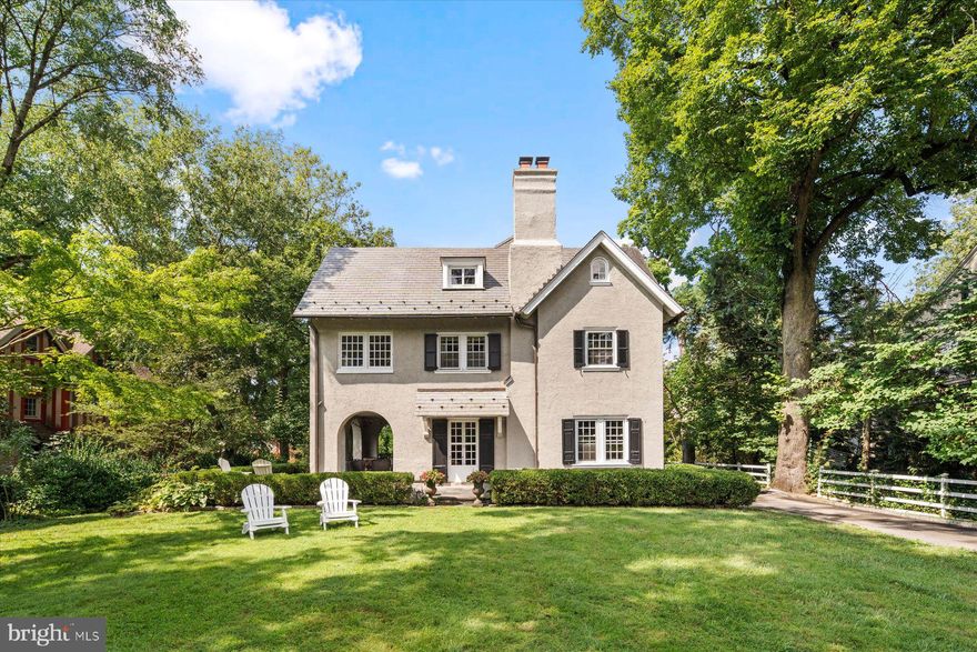 Welcome to charming 109 W. Moreland Avenue! Built in 1925, this wonderful center hall,  Colonial provides the best of both worlds with its peaceful tree-lined street location within walking distance of the shops and restaurants of Chestnut Hill. Situated on a leafy green half-acre lot, the house boasts 6770 square feet of living space. The front door opens up to a wonderful center hall plan with a large living room on the left and dining room on the right, both with fireplaces and window seats. The custom kitchen was designed in 2012 and includes a large island in the center of the room, beautiful countertops, expansive cabinetry, recessed lighting, stainless steel appliances, an attached mudroom accessed from end of the driveway and French doors leading out to a terrace. The large outdoor stone terrace was designed and built in 2010 by local landscape architect, EG Rall and connects to a beautiful covered porch with 4 arches. Each location is perfect for outdoor entertaining.  Back inside and downstairs is a partially finished, very large basement, ideal for playroom or casual gathering spot for teenagers. A magnificent staircase on the first floor takes you up to the second and third floors. On the left, at the top of the stairs, is the primary suite with sitting room, walk-in closet, large bath and sleeping porch/workout area. 3 other bedrooms, bathrooms, laundry room are also on the second floor. Up the staircase, 3 more bedrooms/offices, bathroom and attic space await. The beautiful slate roof was installed in 2000 and a custom designed 4-car garage with a fireplace and unique loft  space for additional storage was built in 2015. This fabulous house is uniquely located in one of the best neighborhoods of Philadelphia with its proximity to the foot paths of the Wissahickon Valley, Septa trains, and the commerce of the village. Enjoy the boutiques, markets and restaurants along The Avenue and easy access to everything that makes the Chestnut Hill area so special. But don’t take our word for it, come see for yourself what makes 109 West Moreland Avenue, so magnificent, inside and out!