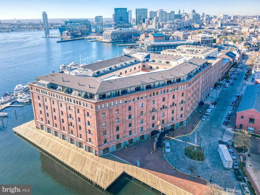 Sophisticated Two-Level Penthouse at Henderson’s Wharf – Waterfront Living at Its Finest
Welcome to a truly exceptional residence in the heart of historic Fells Point. This one-of-a-kind, luxurious two-level penthouse at Henderson’s Wharf offers a rare combination of elegance and comfort, perfectly positioned along Baltimore’s coveted waterfront.
Designed to capture natural light and sweeping vistas, the home features two private balconies: one with views of the harbor, where boats and water taxis glide by, and another overlooking a peaceful, landscaped courtyard. Floor-to-ceiling tinted balcony doors enhance privacy and energy efficiency while framing the scenic surroundings.
Inside, the main level offers an open-concept layout with timeless design details, including rich, prefinished hardwood and a calming neutral palette. The kitchen is both stylish and functional, featuring white cabinetry, quartz countertops, sleek appliances, a center island, and clever storage with pull-out drawers. The adjacent living and dining area is anchored by a vaulted ceiling and a wood-burning fireplace, creating an inviting space for both relaxation and entertaining. Smartly placed charging outlets throughout the home offer modern convenience for all your devices. Lots of attention to detail throughout this home
The first-floor primary suite is a serene retreat, featuring a charming brick accent wall, double custom-designed closet systems tailored for both function and elegance, and a spacious en-suite bath with a double vanity and a beautifully tiled walk-in shower. Additional conveniences on this level include a powder room and a full-size washer and dryer.
A deeded garage parking space ensures effortless city living, while the location—tucked away on a quiet cobblestone street—puts you just moments from Fells Point’s vibrant cafes, restaurants, boutiques, and waterfront attractions.
This one-of-a-kind penthouse is the perfect blend of luxury and lifestyle.
Don’t miss the opportunity to call this waterfront gem your home—schedule your private showing today.