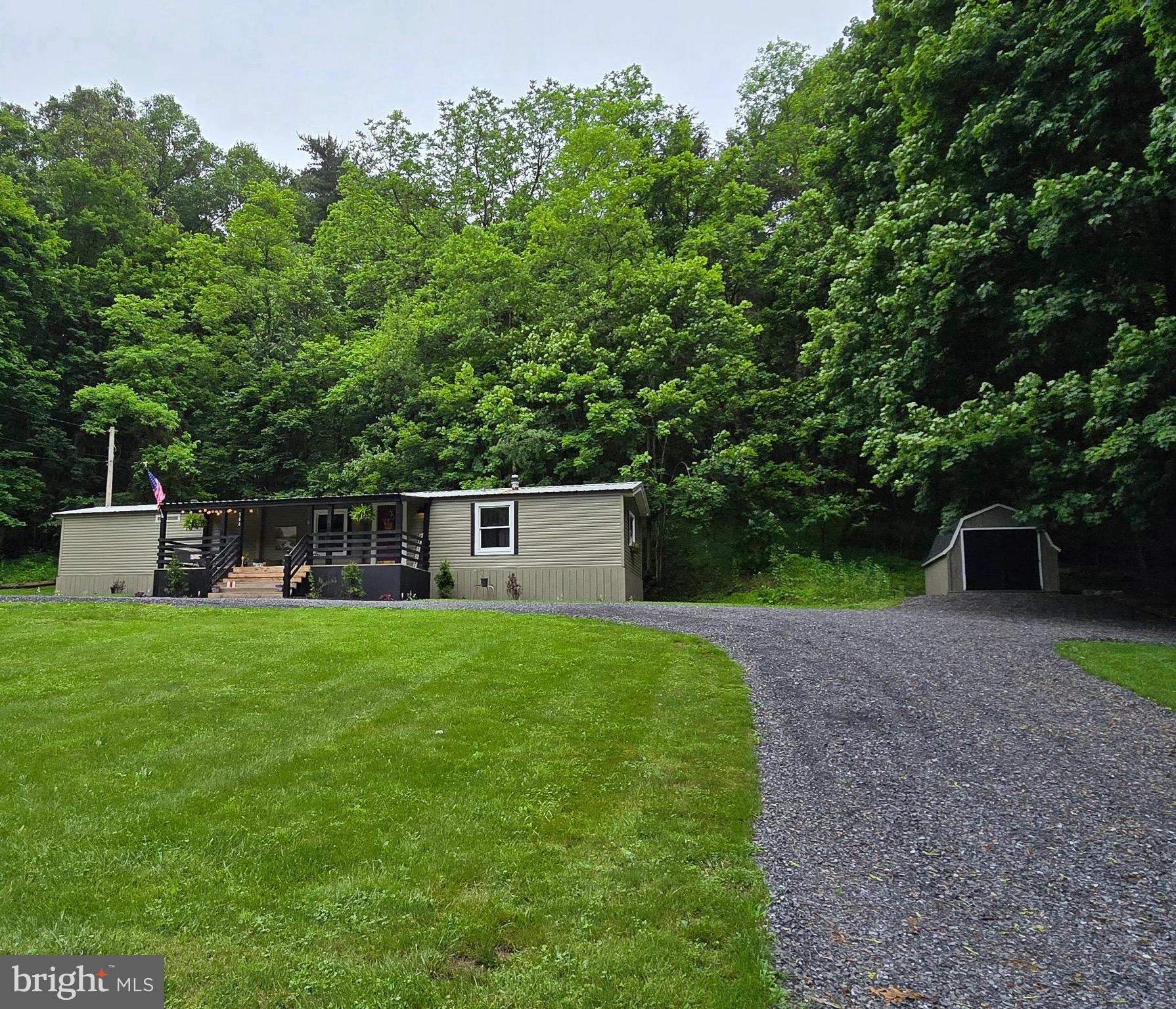 This property has been meticulously renovated top to bottom, inside and out. It features a 2.5 acre lot with a spacious front yard and has been beautifully landscaped. The brand new solid oak covered front porch adds a nice touch of additional living space. The two-tiered back deck offers a private space for relaxation. The wooded area on the property provides a picturesque backdrop for backyard get-togethers. The inside features new flooring in every room, newly installed systems, new plumbing and electrical fixtures, and beautifully decorated rooms. Originally designed to be an Airbnb, it can sell furnished or unfurnished. This property would be the perfect getaway lake house for someone, since it is located 7.7 miles from Lake Raystown Resort.
*Please note that the google earth street view is several years old, prior to current ownership and renovations***