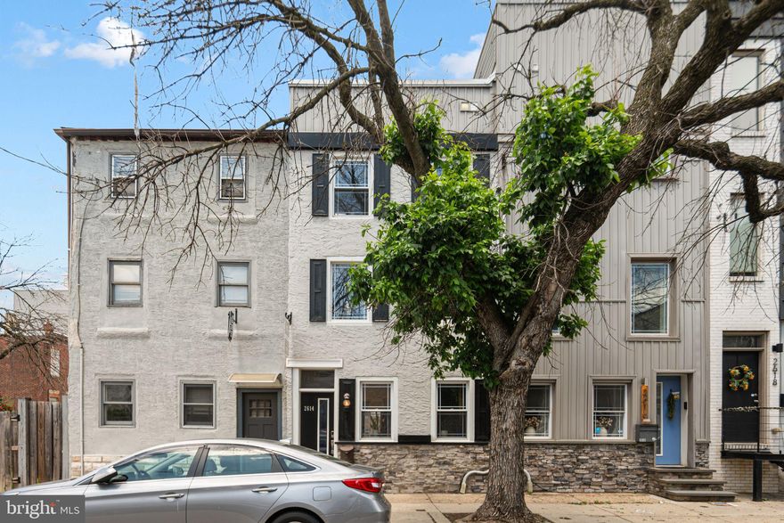 Welcome to 2614 Memphis Street, a beautifully appointed 3-bedroom, 2.5-bath home situated in the heart of Fishtown, Philadelphia. This thoughtfully designed residence blends modern comfort with timeless character, offering an ideal space for both everyday living and entertaining.
Upon entry, you're greeted by an expansive open-concept layout featuring rich hardwood floors, high ceilings, and elegant recessed lighting. The living room offers a warm and inviting atmosphere, enhanced by detailed wainscoting and curated wall decor that adds a unique touch of personality. Flowing seamlessly into the dining area and kitchen, the space is perfect for hosting friends or enjoying quiet evenings at home.
The kitchen is a chef’s dream, outfitted with granite countertops, stainless steel appliances, shaker-style cabinetry, and a large island that doubles as a breakfast bar. Pendant lighting and a farmhouse sink elevate the design, making it both functional and stylish.
Upstairs, you'll find three spacious bedrooms, each filled with natural light and ample closet space. The two full bathrooms are sleek and modern, while the main level also features a convenient powder room with designer tile work and contemporary finishes.
Additional highlights include a modern staircase with custom railing, a finished lower level for extra living or storage space, and a private outdoor area perfect for enjoying the warmer months. Located in the lively and highly desirable Fishtown neighborhood, this home places you within walking distance of some of the city's best dining, coffee shops, art galleries, and nightlife.
2614 Memphis Street offers the perfect combination of location, style, and comfort in one of Philadelphia’s most dynamic communities. Don’t miss your chance to call this stunning property home.