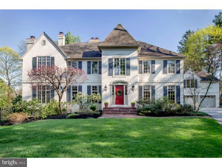 Storybook Charm Meets Modern Elegance in this Beautiful Home with Abundant Natural Light, Open Floor Plan and Generously-Proportioned Rooms.  This special home will charm you from the moment you arrive with its handsome rooftops, classic shutters and rich greenery all around. Expansive, exquisitely-designed, light-drenched living spaces await, welcoming you with a dramatic 2-story Reception Hall. Hardwood floors, decorative moldings, fireplaces with marble/wood surrounds & paneling rising to the ceiling plus oversized sun-filled windows provide a luxurious ambiance. A convenient flow of space with an elegant living room, den with custom cherry bookcases & cabinetry, huge formal dining room with double tray ceiling, and gorgeous sun-bathed family room with 2 walls of windows & glass doors to the deck makes everyday living and entertaining comfortable in every way. The piece de resistance is the gourmet kitchen styled with granite counters, Kountry Kraft cherry cabinets with glass doors, tiled backsplash, premium appliances & large center island with seating. A huge open breakfast room with a wood-burning fireplace, bar & refrigerator connects the kitchen and family room + offers access to the outdoors and large deck.  The bright bedroom level with a hallway skylight houses the huge master retreat, which is sure to impress with its vaulted ceiling, windows on 2 exposures, sitting area, walk-in closets & balcony overlooking the pool & grounds. The stunning master bath with a vaulted skylight ceiling indulges you with radiant heat marble flooring, a whirlpool tub & marble shower. Other features of this exceptional home include 2 mudrooms, a catering kitchen, home office, 3-car garage & spacious lower level with high ceilings, multiple windows bays, laundry room & recreation room. An extremely private property in a prestigious location affords access to the highly-acclaimed Lower Merion Township school system, Center City, Philadelphia International Airport, shopping & other conveniences.