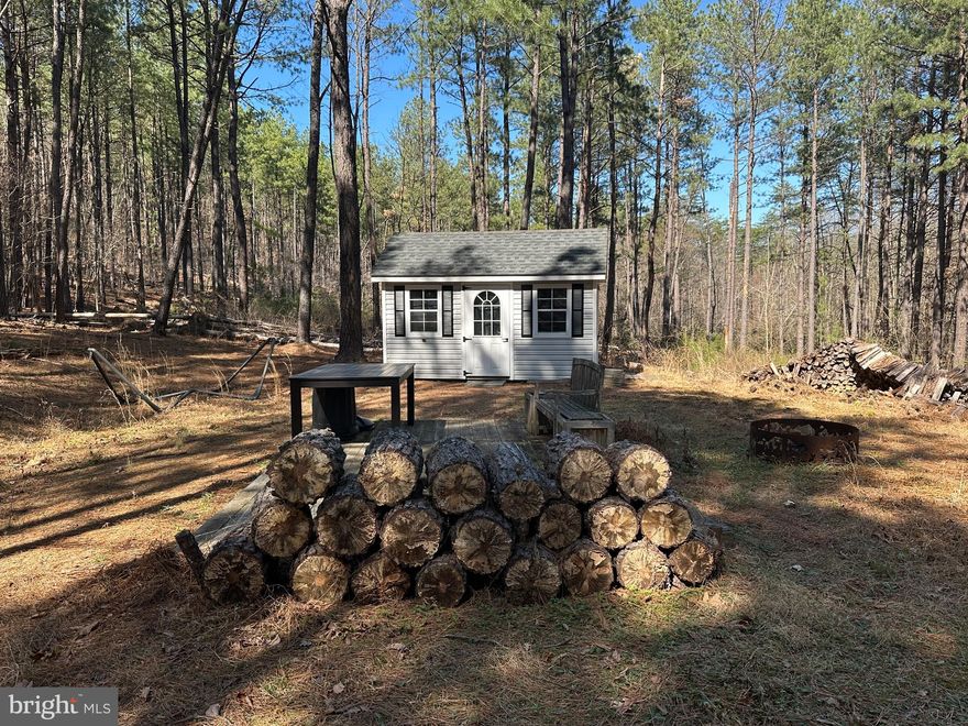 FORGOTTEN CAMP IN THE DEEP FOREST.....40 ACRES COMPRISED OF LOTS 58 & 59 OF MOUNTAIN AIR WITH SO MANY AMENITIES AND SO MUCH WORK ALREADY DONE: GOOD ROAD BUILT DOWN TO THE HOLLOW LEADS TO CAMP/BUILD SITE WITH WELL & 3 BEDROOM SEPTIC INSTALLED, WELL RUNS OFF GENERATOR, WHICH CONVEYS AND IS HOUSED IN ADORABLE SHED. THE SHED IS PACKED FULL OF GOODIES AND ESSENTIALS, EVERYTHING YOU NEED TO GET STARTED AND IT'S ALL INCLUDED!  COOL CLEARING IN HOLLOW AND GREAT SPOT TO BUILD POND. BUILDING SITES & DRIVEWAYS ONCE DONE ON THE TOPS OF BOTH LOTS OFFER GEORGEOUS VIEWS OF THE GREEN SPRING VALLEY AND WHITE HORSE MOUNTAIN, BOTH DRIVEWAYS AND PADS ARE OVERGROWN WITH PINE SAPPLINGS AND NEED RE OPENED. A SKILLED OPERATOR ON A DOZER COULD HAVE BOTH UPPER BUILD SITES RE OPENED IN A DAY. EASILY 50K WORTH OF INFRASTRUCTURE IN PLACE, FOR 10K YOU COULD PULL THE ELECTRIC DOWN TO THE CAMP SITE AND BE FULLY FUNCTIONAL......LOCATED ALL THE WAY AT THE BACK OF GATED COMMUNITY FOR MAXIMUM PRIVACY, THE LAND DOESN'T LAY BAD AND IS COVERED IN GORGEOUS LOBLOLLY PINES & HARDWOODS. HUNT, SHOOT, CAMP, HIKE, ATV'S.....BUILD IN THE BOTTOM OR BUILD ON TOP, BRING A BUDDY OR FAMILY MEMBER BECAUSE THERE ARE TWO LOTS.....BUILT IN EQUITY, IF YOU HAD TO BUY BOTH LOTS AND START FROM SCRATCH, YOU'D BE AT 275K IN A HEARTBEAT. YOU DON'T HAVE TO BE MISS CLEO TO READ THE CARDS ON THIS ONE, THE VISION IS IN PLAIN SIGHT!