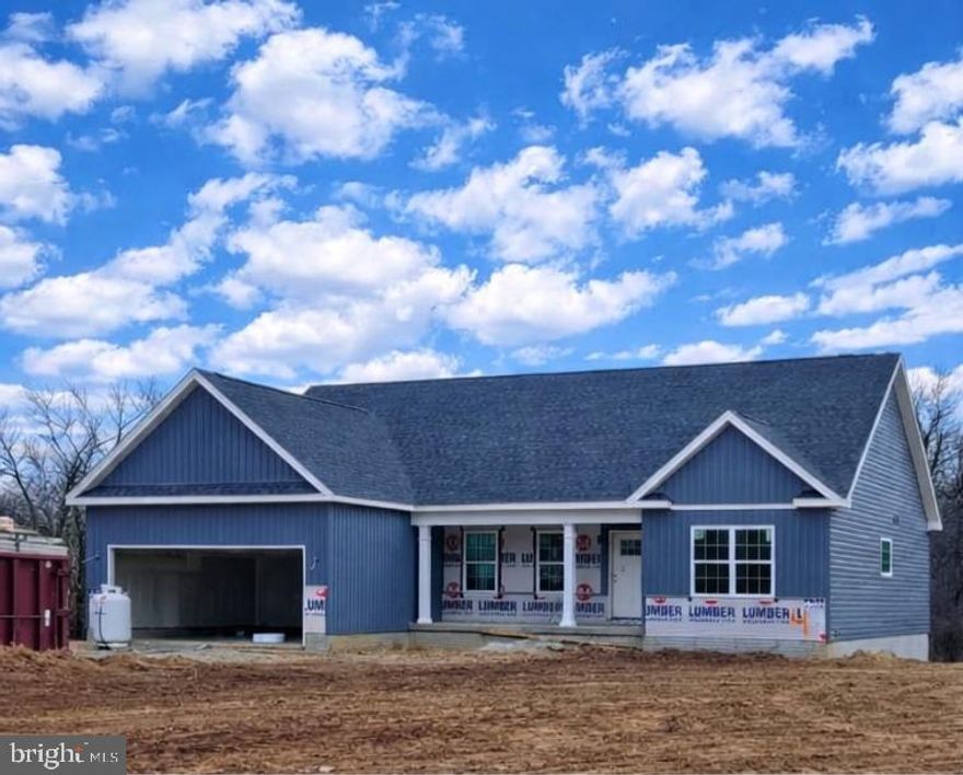 June 2026 delivery on this Brand New ranch home!!   This 1,670 square foot Ranch style home boasts the sought after split bedroom design. The kitchen/dining combo is open to the expansive great room and features vaulted ceilings.  Quartz, ceramic, luxury vinyl plank flooring, carpet and stainless steel appliance package. Primary bath has a separate tiled shower and soaking tub! Home is larger than it looks providing maximum usage of interior space. The front porch is great for evenings relaxing in a country setting that is close to amenities.  Full walkout basement.  Buyer pays transfer tax stamps.  Measurements are approximate. The pictures will be similar to your new home .