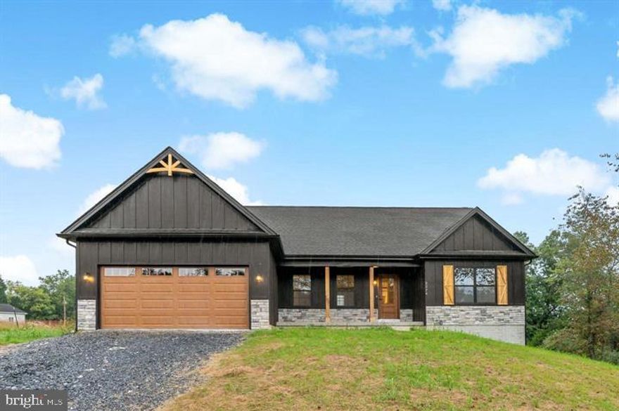 MAY 2026 delivery on this Brand New ranch home. This 1,670 square foot Ranch style home boasts the sought after split bedroom design. The kitchen/dining combo is open to the expansive great room and features vaulted ceilings. Quartz, ceramic, luxury vinyl plank flooring, carpet and stainless steel appliance package. Primary bath has a separate tiled shower and soaking tub! Home is larger than it looks providing maximum usage of interior space. The front porch is great for evenings relaxing in a country setting that is close to amenities.  Full walkout basement.  Buyer pays transfer tax stamps. Measurements are approximate. The pictures will be similar to your new home . Shown with stone water table upgrade.