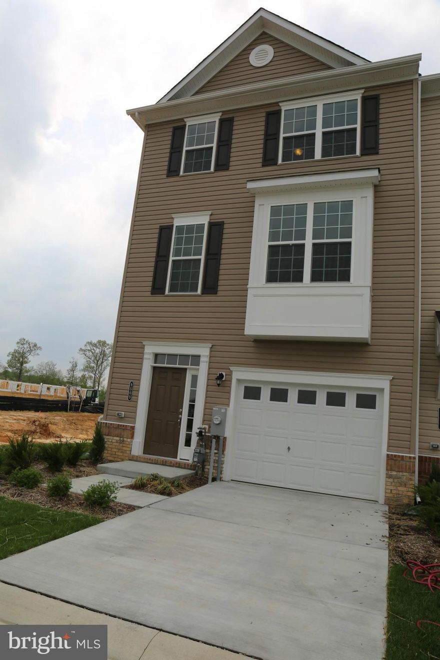New Move In Ready Home!  Beautiful 3 Story End Of Group Townhome With 3 Bedrooms, 2 Full And 2 Half Baths. Spacious Kitchen With Hardwood Floor And Granite Counters.  Open Floor Plan.  Huge Deck Ready For Entertaining.  Basement Covered Walk Out. AND 1 Car Garage.