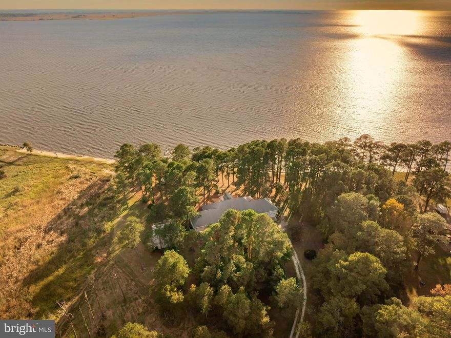 Welcome to 3109 Fair Island Lane! This is an Estate Sale and Sellers are motivated. This Unique Waterfront Gem sits on 11 Plus Acres near the mouth of the Pocomoke River as it approaches the Chesapeake Bay! Looking for Peace and Quiet in a Secluded Paradise,,, look no further!!! The Home is over 3100 SF and features 3 Bedrooms and 2.5 Baths. From the moment you step into the enclosed porch entrance you will be in awe of the breathtaking panoramic views in the expansive living room.  Step out into the enclosed Sunroom to continue enjoying the scenic backdrop!!! The open kitchen space has plenty of room for the chef of the house and is perfect for entertaining. Currently being used as an office, you’ll find a large additional space that could be an added living room or exercise area.  New flooring has been installed in that room as well.! The Owners Suite is Massive and features Hardwood flooring and exposed beams. The Owner's Private Bath is also expansive and full of updates. . There are two more bedrooms and 1.5 additional baths to accommodate extended family or guests. An added bonus is found up the spiral staircase to the open balcony area with views of the River. An attached workshop and two car garage are great for storage or projects to be completed. Stroll out onto the private pier with Boatlift to take in the magnificent sunsets or partake of your favorite watersports (Boat launch is only minutes away to get the boat to the lift).  A detached garage and carport are perfect for storing all your equipment and toys. New Septic installed in 2026. New Well Pump 2026. The heat is Geothermal as well! Priced under appraised value, this beauty won’t last long!