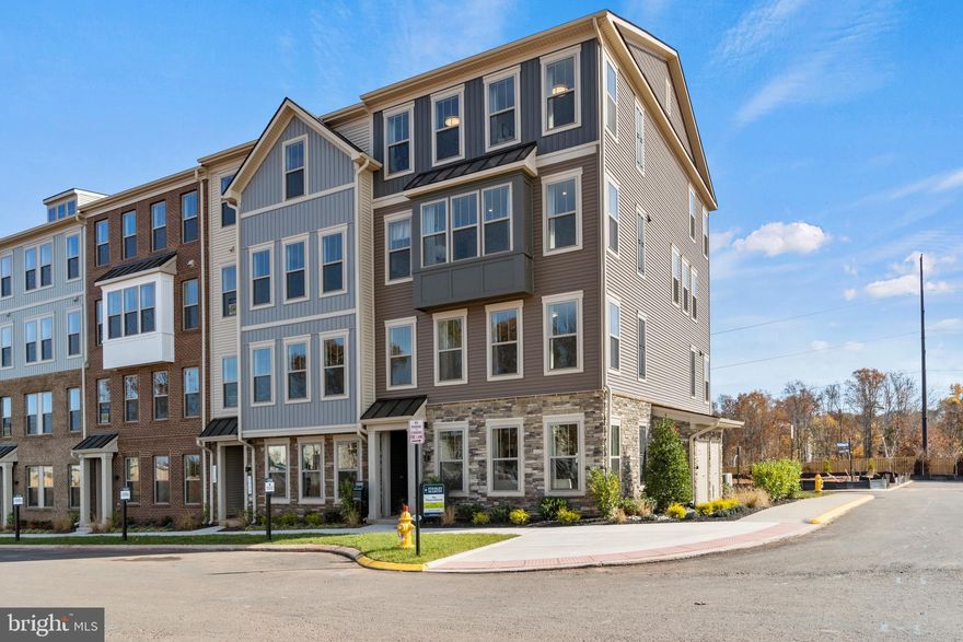 Brand New Stanley Martin 2 Level Garage Condo Village at Manassas Park is conveniently located amongst upcoming shopping, dining, entertainment, and outdoor recreation fun. Commuting convenience and low maintenance living is what we're all about! Just a 2-minutes to the Virginia Railway Express Station that will take you into Washington D.C. Spend less time with commuting and maintenance and more time making memories with loved ones at home. Manassas Park City Hall at Park Central offers brand new 2-level public library with a brand-new Sprinkler Park! Step inside our upper-level condo, the Julianne, and immediately fall in love with the elevated layout and contemporary feel. Light pours in from both ends of the main level, illuminating the space as it flows from family room, to kitchen, over to the eating area. The 12-foot island provides a luxurious center piece anchoring the kitchen, friends and family will find it easy to mingle and enjoy each other's company around. Retreat to the upper level, where you'll find two additional bedrooms. Transform this space into a work-from-home space, guest bedroom, game room or home gym. This home has been designed to spoil its owner with enormous walk in closet and an oversized bedroom. Our brand-new Julianne offers a fresh contemporary curb appeal featuring a garage with a full driveway, full sized driveway for an additional car and an abundance of guest parking throughout the new neighborhood. Move in this Fall! 

*Photos are of a similar home.*