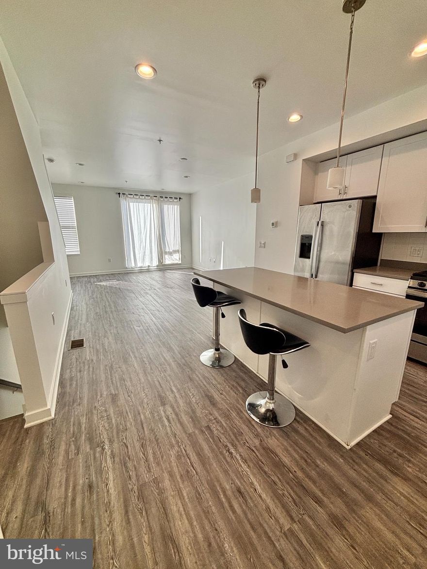 Welcome to North Bank, one of Philadelphia’s most sought-after riverfront communities. This stunning 3.5-year-old home is truly a dream come true, offering modern luxury, thoughtful upgrades, and an unbeatable location just steps from the Delaware River. Enjoy scenic walking trails, peaceful water views, and front-row access to fireworks on New Year’s Day. With 6 years of tax abatement remaining, you’ll also benefit from significantly reduced real estate taxes.

The entire home has been freshly painted, and the oversized one-car garage has been fully finished with drywall and paint—no exposed studs or rough surfaces. This home features countless upgrades throughout, including premium flooring, upgraded stairs, high-end appliances, and more.

As you enter through the modern matte-black door with stainless hardware, you are greeted by the first-floor flex space—perfect for a home office or gym—with a window overlooking the community. Access to the large garage is located on this level, offering ample room for your vehicle plus storage.

The second floor boasts an open-concept living area with a contemporary kitchen featuring an island, stainless steel appliances, and sleek cabinetry. The spacious living room is ideal for entertaining guests or unwinding after a long day.

On the third floor, you’ll find two generously sized bedrooms. One bedroom includes its own private ensuite with a dual vanity and a soaking tub—perfect for relaxing evenings. The second bedroom offers great space and ample closets.

The top floor is dedicated to the primary suite, featuring his-and-hers closets, a beautiful bathroom with dual vanity, and a walk-in shower. The primary bedroom also offers direct access to a large private balcony with captivating views—a true retreat.

Located minutes from Center City, Penn’s Landing, the Benjamin Franklin Bridge, and major highways, this home delivers both convenience and lifestyle.

Schedule your tour today—you will not be disappointed!