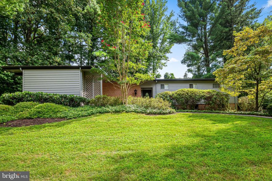 Welcome to 3207 Midfield Road in the heart of Pikesville! This stunning mid-century split-level home is nestled on a half-acre lot, adorned with lush landscaping that creates a serene and private oasis. As you approach the property, you'll be greeted by a circular driveway and a covered carport, providing ample space for parking. Step inside and be captivated by the charm and character this home exudes.  The eat-in kitchen with vaulted ceilings and a skylight, features gas cooking, granite countertops and conveniently opens to a delightful side patio, perfect for sipping your morning coffee or enjoying a relaxing evening breeze. The Living room and Dining room are the focal point of the main level offering open space for entertaining and large gatherings with the allure of a wood burning fireplace. With two huge sliding doors, natural light and fresh air are a must... especially on the attached screened patio. The finished lower level of this home boasts a wonderful rec room and  an additional room that can be used as a bedroom or office, providing the flexibility to suit your needs. Situated at the end of a quiet cul-de-sac, this tranquil setting is intended to be a great escape away from the hustle and bustle of city life . The  landscaped backyard provides a serene retreat, where you can relax and enjoy the beauty of nature.