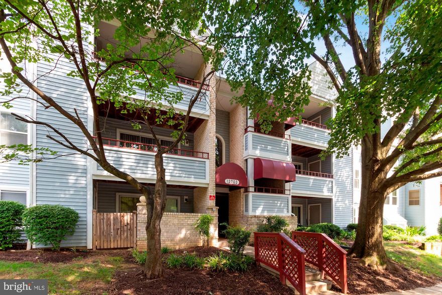 **Offers, if any, due Sun 9/13 by 8pm** Rarely-available 2-bed, 2-bath condo with upgrades galore! Enter to bright and airy living space with gleaming hardwood floors throughout. Gourmet kitchen boasts granite countertops with stainless steel appliances, ample cabinetry and eat-in space. Cozy up by the living room fireplace, accented with built-in shelving on either side, or relax on private patio with tree-lined views. Owner's suite features two large closets and spa-like bath with dual sinks and tiled shower. Spacious second bedroom and separate full guest bath with upgraded vanity and tile. Washer and dryer in-unit! Newer HVAC with bluetooth thermostat (2019) and end-to-end renovation completed in 2017. Community includes a gym, outdoor pool and party/meeting room. Short distance to Fairland Rec park with walking/biking trails, soccer fields and tennis courts. Just minutes to Target, grocery and restaurants. Easy access to 200, 29 and 95. Enjoy the stair-free life in this pet-friendly first floor condo!