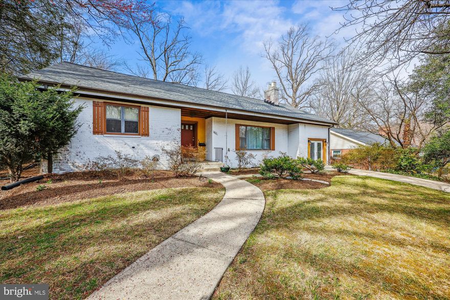 Experience spacious living in this charming brick home located in the heart of downtown Silver Spring. The property boasts a substantial rear addition, creating an expansive living area and an open floor plan ideal for entertaining. It’s within walking distance of the Sligo Creek Hiking Trail and only 1.6 miles from the Silver Spring Metro Station.

Looking for a one-car garage? The space is available! By simply installing a door, you can easily convert it into a functional one-car garage.  

As you enter this three-bedroom, three-bath home, you'll notice hardwood floors and many windows throughout the main level. Step down from the foyer into the living room, which features a wood-burning fireplace, brick surround and built-ins, and a large picture window. 

The kitchen has been beautifully remodeled and features a pocket door, stainless steel appliances, trash compactor,  a spacious island, granite countertops, updated cabinets, a built-in pantry, a wine rack, a microwave, a trash compactor, and recessed lighting.

You can access a spacious family room addition from the kitchen. This room features a high cathedral ceiling and clerestory windows along the back wall, allowing for maximum natural light and providing a beautiful backyard view. It has a ceiling fan, a stone gas fireplace, and a sliding glass door that opens to a deck. The deck includes a built-in granite table and a gas hook-up for a grill. Additionally, an office adjacent to the kitchen is filled with abundant windows and a distinctive brick wall that adds charm to the space.

The hallway features an extensive floored attic with pull-down stairs, a large cedar closet, and an attic fan.  Off the hallway is the primary bedroom with an ensuite bathroom with a tiled floor and a shower with tile surround. This bedroom also has a ceiling fan, a sizable wall closet with an Elfa closet organizer, and Pella Fsliding doors with built-in blinds and a screen, that leads to a deck and overlooks a beautifully landscaped wooded backyard with a fountain, slated garden wall, stone walkway and shed. 
 
In addition, you will find two more bedrooms; one of them has knotty pine walls. A full-hall bathroom features a combined shower and tub, a tiled floor, and partially tiled walls.

You can access the finished lower level through two separate entrances: one from the kitchen and the other from the family room. This level features new flooring and includes a recreational room, a bonus room, a full bathroom, a cedar-lined closet, and two large storage areas for ample storage and the flexibility to add additional finished space. Additionally, there is a second kitchen with a butcher block breakfast counter and a laundry room equipped with cabinets, a sink, a folding area, a washer, and a dryer. 

As a bonus, you can enjoy the convenience of a central vacuum cleaner for easy maintenance and the benefits of a new roof and an HVAC system estimated to be five years old.

Don't miss this chance to enjoy a home in the Seven Oaks neighborhood, which provides easy access to parks, biking and walking paths, major highways, and all the amenities of Silver Spring, including restaurants and shops.