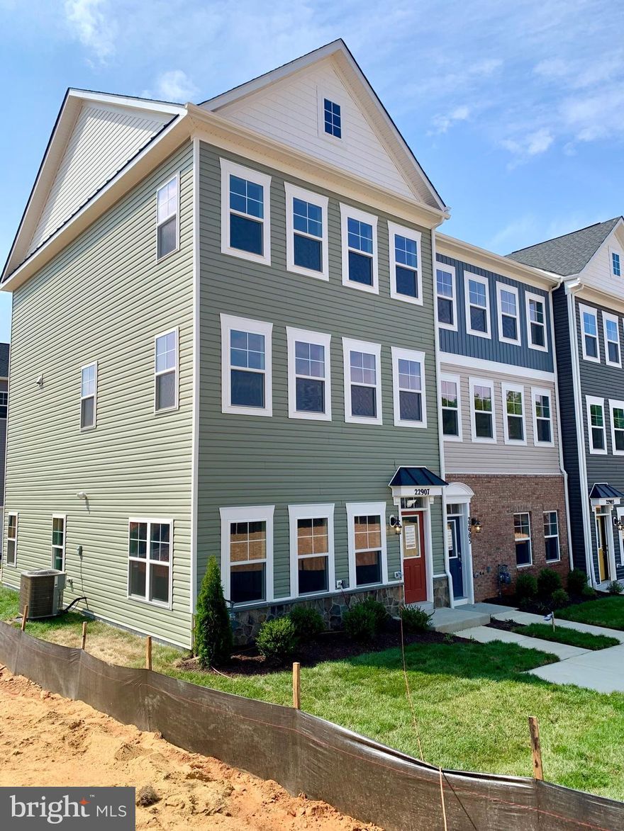 Brand New Camden II End Unit is Ready for Move In! This is the final new townhome is highly sought after Bellamy!
Enter this home on the lower level and head up to the stairs to the heart of the home. The main level is perfect for entertaining featuring an eat-in bar and a rear kitchen open to the dining and living rooms. Abundant natural light from the large front windows flows through the main level.  Mohawk Driftwood in Beachwood 7' luxury vinyl plank flooring is found throughout the entire home with the exception of the bedrooms, and compliments the oak stairs. 
The kitchen features a stainless steel appliances, Carrara Marmi Quratz countertops, white Elkins laminate cabinets, pantry, breakfast nook and sliding door to the rear sundeck.
Upstairs, you’ll find 3 bedrooms, two secondary bedrooms and the primary suite offers a large walk-in closet and en suite with a dual vanity. The upper level also features a convenient laundry area and full bath. 
The Lower Level has been finished with a Rec Room and Half bath.
Nestled in the heart of sought-after Clarksburg, Bellamy is conveniently located just 1 mile from I-270 & Stringtown Rd. Here, you’ll find a limited selection of 50 homes with both single-family and townhome options available. And of course, all your favorite local destinations are within easy reach.
Hurry! This final townhome won't last long!