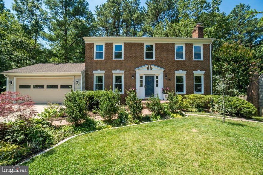 Swoop in on this swoon-worthy home!  Board and Batten trim, shelf molding, sconces and built-ins. The only thing missing is your decor! Fresh paint, all new carpet, gorgeous hardwoods, updated classically white kitchen with stylish back-splash and high-end granite. Newer appliances. Additional matching cabinetry, granite & backsplash being added around refrigerator! Updated owner's bath w/seamless shower! Two fire places, multi-level deck, hot-tub, lushly planted landscape, fire pit and fully fenced.  Basement level has full bath and bonus room!