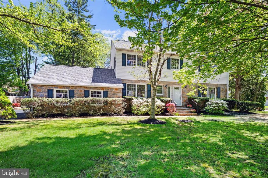 Welcome to "The Blue Stone Home," 17 Briar Road in sought-after Briarwood, one of North Wilmington's most picturesque neighborhoods, known for its mature trees and timeless appeal. This spacious 4-bedroom, 3 full bath home with a 2-car garage offers a wonderful blend of classic charm, thoughtful updates, and everyday functionality. The property is situated on a 0.3-acre treed corner lot accented with azaleas, magnolias, and crepe myrtle. It also features two raised bed gardens for vegetables and herbs and a comprehensive irrigation system. Step into the welcoming foyer which leads into the sun-filled living room featuring handsome hardwood floors, a wood-burning fireplace with stone surround and mantel, and energy efficient windows. The living room flows seamlessly into the dining room, which overlooks the rear yard, provides outdoor access, and includes a convenient pass-through to the kitchen—ideal for both everyday living and entertaining. The well-appointed kitchen features custom oak cabinetry, granite countertops, a Sub-Zero refrigerator and freezer, range with oven plus a second oven, two dishwashers, microwave, two sinks, under-cabinet lighting, and abundant storage and workspace. Just off the kitchen, the inviting family room offers built-in shelving and desk space, chair rail and crown molding, and direct access to the backyard. A main-level full bath with a walk-in shower adds flexibility for guests or everyday convenience. Upstairs, you’ll find four well-sized bedrooms, all with hardwood flooring. The primary suite includes two closets, including a double closet, and an en-suite full bath with a stall shower. Three additional bedrooms provide generous closet space, including one with both a double closet and a separate large cedar closet. A hall bath with tub/shower combination, a linen closet, an additional hallway linen closet, and pull-down attic access complete the upper level. The basement offers excellent storage, includes the laundry area, and features an egress door for added convenience. This space also provides ample room for activities such as ping pong and woodworking. Additional highlights include a new single-layer shingle roof, a handicap-accessible rear ramp (which can be easily removed), a heat pump with gas backup for heating and cooling energy efficiency, and a new sewer line from the home to the street. Ideally located with easy access to I-95 and Route 202, this home is just minutes from shopping, dining, and parks. For travel and commuting, the Philadelphia International Airport is only 25 minutes away. This is a home you won’t want to miss. Schedule your tour today!