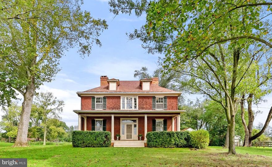 Offered for the first time, Abbeyville is a rare 146-acre estate in Clarke County, superbly located just outside Boyce. Built in 1909, this property provides unmatched versatility with additional dwelling unit rights and a multitude of possibilities—a private residence, equestrian estate, working farm, family enclave, or new build. With potential for limited subdivision and prime eligibility for land conservation programs and easement tax credits, Abbeyville presents an extraordinary opportunity. This Colonial Revival house is a living antique, rich in original features, perfect for anyone looking to own and restore a piece of history. Featured in "Clarke County, Virginia: History Through Architecture," Abbeyville is a classic example of American Foursquare design. The original front door opens to a spacious foyer, with the Dining room with fireplace on one side and the Living Room with mountain views and its own fireplace on the other—both can be enclosed with original pocket doors. The library, with built-in bookshelves and wood stove, offers an ideal retreat for reading or work. The main level is completed by a kitchen and half bath. Upstairs, three oversized bedrooms with fireplaces, two smaller bedrooms, and a full bath, offer ample space and potential. Outside, the rare wood shingle siding is complemented by a pressed-tin roof and two corbelled brick chimneys. The south-facing front porch spans the width of the house, perfect for relaxing or dining alfresco. Surrounding the house are open, rolling pastures, divided into 20- to 40-acre fully fenced fields. The barn provides storage and shelter for livestock. The western fields are currently used for grazing cattle, while the eastern fields, used for hay production, have scenic views. A 2-bedroom tenant house (#410 Old Winchester Rd), built in 1999 on the original spring house site, offers multi-generational living or rental income potential. Live the country life near historic estates like Long Branch, The Tuleyries, and Carter Hall. Host guests at nearby Villa La Campagnette. Play at the State Arboretum, Sky Meadows State Park, and the Shenandoah River—all within a 15-minute drive. Enjoy local restaurants, wineries, breweries, and golf courses with quick access to Rt 340, Rt 7, Rt 50 and I-81. Located 20 minutes from Winchester and Front Royal, 45 minutes from Middleburg, and just 90 minutes from Washington DC.