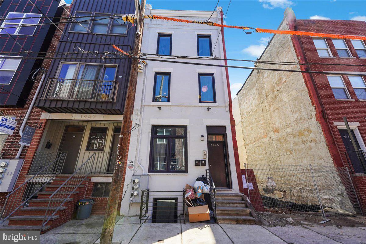 Discover an exceptional investment opportunity at 1945 N. Gratz St., situated in the thriving Temple University area. This duplex was beautifully renovated in 2018 and still benefits from the remainder of a 10-year tax abatement! Fully occupied through July 2025, this property offers an ideal blend of modern amenities and convenience, attracting students and renters alike.
**Unit A** features a thoughtfully designed layout with hardwood floors throughout, accommodating 3 spacious bedrooms, each with its own private bathroom, plus an additional half bath on the first floor. The unit's well-appointed kitchen opens to the living area and this unit features a fenced spacious back patio, perfect for outdoor gatherings and BBQs. Each bedroom is equipped with custom closets, providing ample storage space, a feature highly valued by tenants.
**Unit B** boasts 5 generously sized bedrooms and 3 modern bathrooms, making it an attractive option for students seeking comfort and style. The kitchen, adorned with sleek white cabinetry, a large island and stainless steel appliances, offers a fresh, contemporary look. Carpeting throughout the bedrooms adds an extra layer of soundproofing, enhancing privacy and tranquillity.
Both units are separately metered and include air conditioning for comfort during warmer months and a security system for peace of mind. This property not only meets the demands of the current rental market but also stands out as a lucrative investment in a sought-after location. Don't miss your chance to own this exceptional property in the heart of the Temple University area.
