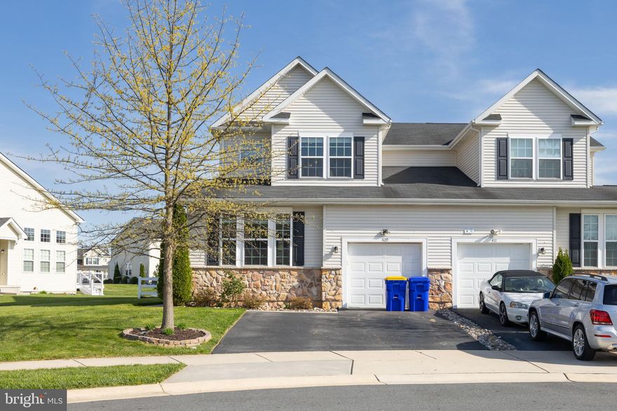 Welcome to 409 Galway Court in the Popular Community of Hyetts Crossing. Conveniently located with quick access to Rt's 1 & 301.  This Home is the Spacious Chesterfield Model Carriage House with a Main Level Owners Suite.  Designed for Open Concept Living the Main Level has a Great Room with a Break Away Ceiling (2 Story High) with 2 Walls of Windows allowing in ample sunlight. There is a Gourmet Kitchen with Enamel White Cabinets,  Large Center Island, Granite Counter Tops, Tile Backsplash, 2 Wall Ovens, B/I Micro Wave Oven & a Side-by-Side Refrigerator.  All Appliances are Stainless Steel.  There is also a Dining Room just offer the Kitchen.  A conveniently located center hall just off the Entry Area leads to the 2nd Floor Turned Staircase,  Access Door to the Garage, the Laundry Closet & The Owner's Suite which is spacious with a picture window and a Walk-in Closet. The Full Bath has a Double Sink with ample storage in the Vanity and Glass Enclosed Tile Shower with seat. The Main Level and Upper Level have recently installed LVP  Flooring, Neutral Stain. There is also has a Powder Room on this level. The Upper Level has a Loft Area perfect for a Home Office, Exercise Area or TV Room. There are 2 Guess Bedrooms. The Front Bedroom has its own Full Bath and Walk-in Closet. There is also a 3rd Full Bath and a 2nd Bedroom just off the Loft. The Lower Level is a Full Basement with Poured Foundation/Insulated & a Egress Window. Perfect Area for future living space. There is a Deck just off the Kitchen that over looks Fenced rear yard.