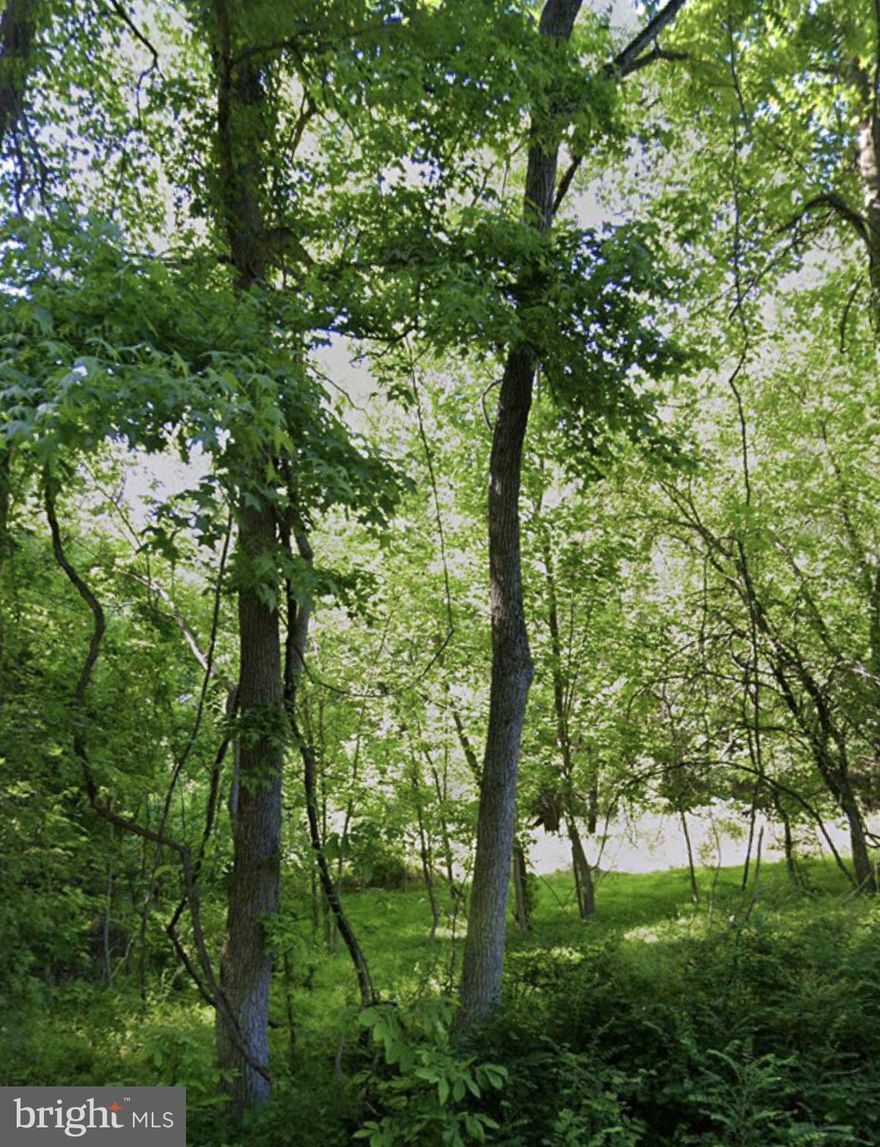 Build your dream home on the pre-existing developed site on this stunning 27+ acre property adjacent to Merkle Wildlife Sanctuary. Enjoy recreation, potential wood crops, and beautiful wildlife habitat on this property. Buyer to verify development potential. Sold strictly as-is.