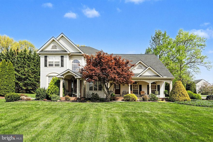Located in the highly desirable neighborhood of Logan Downs and within Northern York School District, this beautifully maintained 4-bedroom, 2.5-bath colonial offers over 2,800 square feet of timeless charm, thoughtful design, and exceptional curb appeal. A gorgeous front porch sets the tone, offering the perfect place to relax and enjoy the peaceful surroundings. The home makes a striking first impression with its paver driveway, walkways, and rear patio, all complemented by mature, immaculately maintained landscaping that reflects true pride of ownership. Set on a spacious half-acre lot, the outdoor space is as inviting as the interior, making this home ideal for both everyday living and entertaining. Inside, the main level showcases hardwood flooring throughout and a layout that is both functional and rich in character. Architectural details elevate every space, including crown moulding in the formal living room and a beautifully appointed dining room featuring a tray ceiling, chair rail, and shadow box wall accents. Arched doorways and windows add elegance and visual interest throughout the home. The great room is a true focal point, featuring a vaulted ceiling and a propane fireplace insert with a warm brick hearth—creating an inviting space to gather or unwind year-round. Upstairs, the primary suite is exceptionally spacious, offering a true retreat with a cathedral ceiling and an ensuite bath complete with a relaxing soaker tub and a walk-in shower. Three additional bedrooms and a full hall bath provide flexibility for family or guests. The finished lower level provides valuable additional living space that can be tailored to your needs—whether as a home office, den, playroom, or more. Rich in character and designed with both style and comfort in mind, this home blends classic features with everyday livability in one of Dillsburg’s most sought-after communities. Don’t miss this rare opportunity to own a truly special home in a neighborhood known for its beauty, convenience, and strong sense of community.
