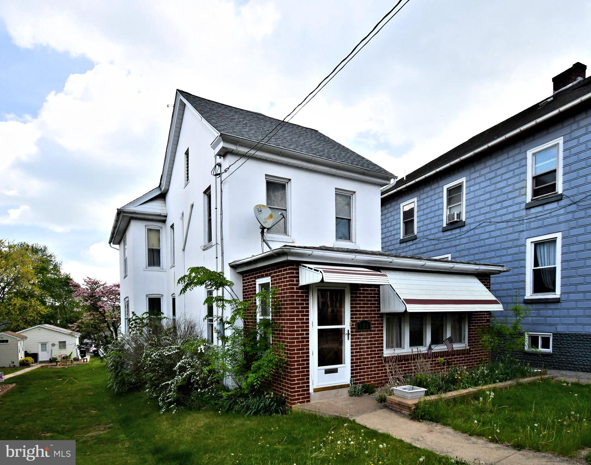 Freshly Priced at $350,000 – Historic Charm Meets Everyday Functionality
Step into a piece of East Greenville history with this lovingly maintained 3-bedroom, 2-bath detached colonial located in the heart of town. Now offered at $350,000, this unique property blends timeless architectural character with modern updates, offering exceptional value and opportunity.
Featuring over 2,000 square feet of living space across three levels, this home includes a spacious living room with inlaid hardwood floors and an original stained glass window, a formal dining room, and a bonus enclosed porch that doubles as a light-filled foyer or flexible sitting area. The updated kitchen offers ample cabinetry and workspace, with electric cooking, built-in microwave, and dishwasher included. A main floor full bath and first-floor laundry add extra convenience.
Upstairs, you'll find three generously sized bedrooms, a second full bath, and an additional flex space perfect for a home office, playroom, or sitting area. A walk-up attic provides abundant storage or future finished space. Notable improvements include ductless heat pumps for efficient heating and central A/C, a 200-amp electrical system, and a newer hot water heater.
Outdoors, enjoy a private, level backyard, one-car detached garage, and carport with off-street parking for up to three vehicles. Situated on a quiet street with sidewalks and street lighting, this home offers walkable access to shops, parks, and schools within the Upper Perkiomen School District.
We’ve been told this charming brick home once served as the Toll House Keeper’s residence and even as the East Greenville Savings & Loan office—adding to its rich local heritage.