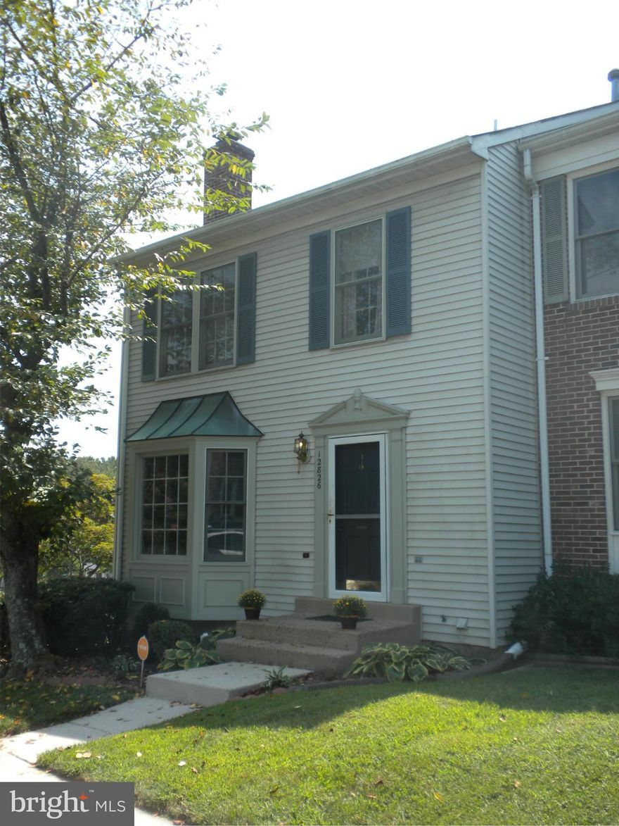 Just REDUCED! Lovely end unit in Old Bridge Estates.  Large  kitchen with skylights, island,pantry and ceramic floor,  fenced in yard that backs to wooded area.  Master bedroom with full bath and walk in closet.  Finished basement with rec room.  2 fireplaces. Great community w/ pools, tennis, marina. Close to Ft.Belvoir, Quantico, and Pot. Mills Mall