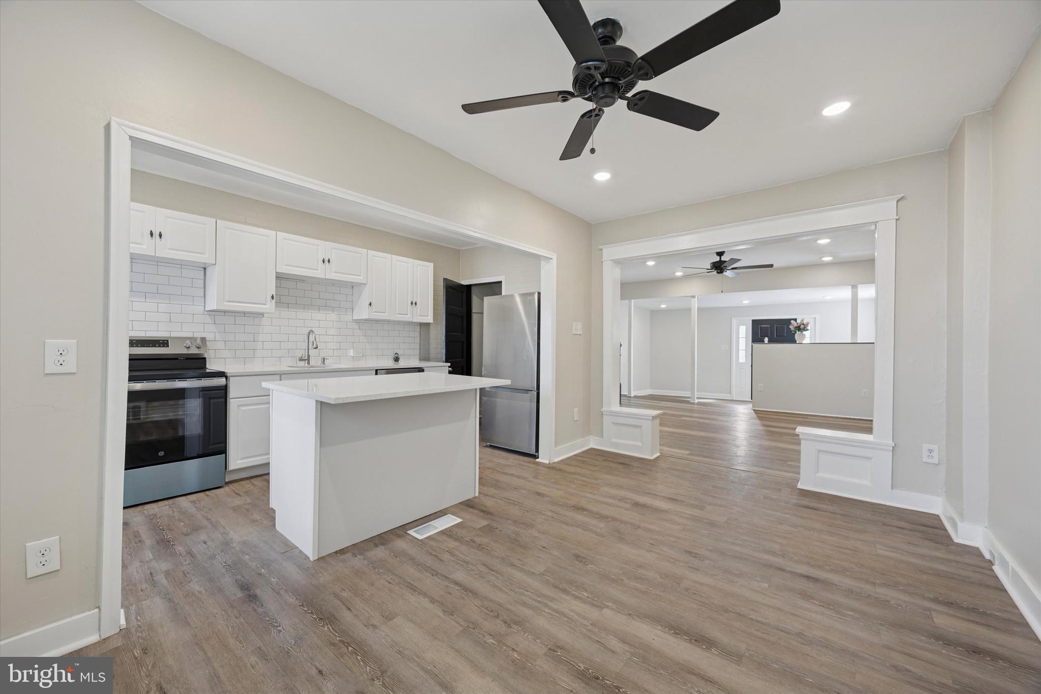 Welcome to your new home in Marcus Hook! Recently completed upgrades including new vinyl flooring throughout, new kitchen, and bathroom improvements - this home is move-in ready! The main level begins with an enclosed porch that adds to the first floor space - imagine an entry foyer, additional sitting area, or office space. The living room provides plentiful space to create an inviting sitting area and includes ceiling fan and recessed lighting. The renovated kitchen is open to the dining area and features island with breakfast counter, subway tile backsplash, and new stainless appliances - a great place to enjoy with family and friends in the heart of the home. Upstairs, there are 3 bedrooms and tiled hall bath with tub shower, new vanity, new fixtures, new flooring, and skylight supplying ample natural light. The home also includes an unfinished basement for plentiful storage space and includes the laundry area. Outside, enjoy the covered patio in rain or shine. A fenced yard offers room to grill, garden or play - plus, 1 parking space. Conveniently located around the corner from bus lines and the Marcus Hook train station, and in close proximity to I-95 for easy commuting. If you're home shopping in the area, be sure to add this home to your list!