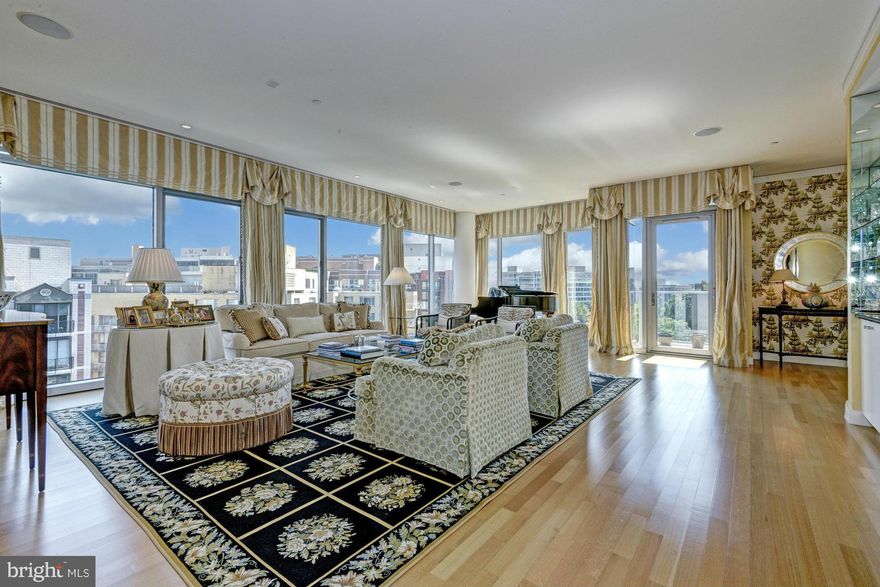 Stunning upper-level 2,995sf appt at coveted 22West w/ unparalleled views of Washington Circle. Highlights include an expansive foyer, huge living room with walls of glass, large eat-in kitchen w/ SS appliances and granite counters, den/library, 2 private balconies, and 2-car reserved parking. Building offers 24-hr concierge, rooftop pool and sundeck, fitness room, and party room.