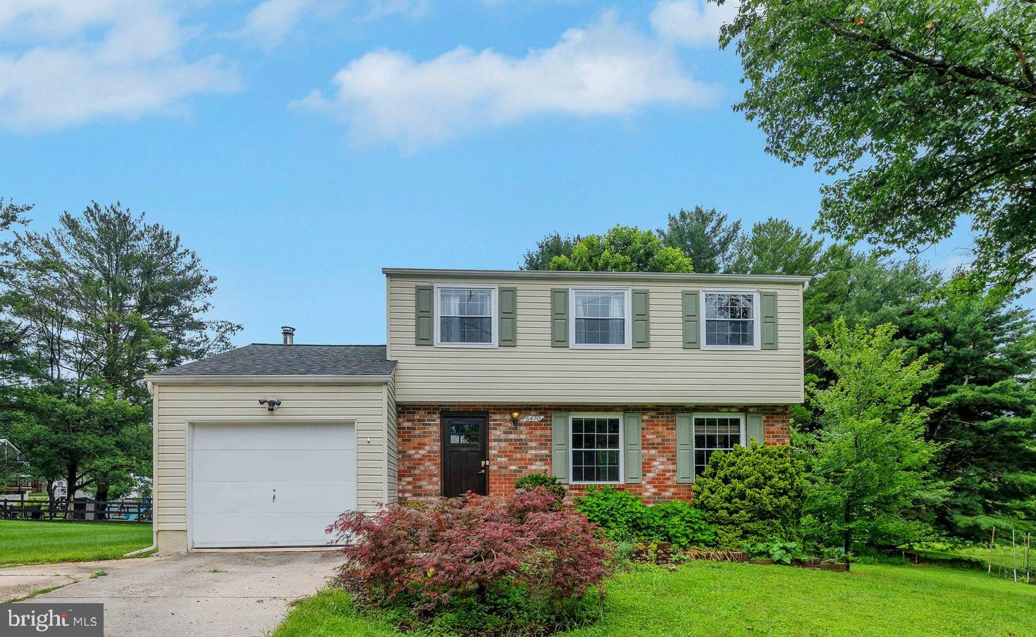 Spacious colonial located in sought after Village of Owen Brown community. Nicely updated throughout..including new kitchen with an open floor plan..Canadian hardwood throughout..Formal living room leads you into the spacious kitchen with breakfast area and stainless steel appliances. Cozy family room off kitchen with wood stove. Screened porch overlooks serene backyard with shed. Upper level features primary bedroom with full bath, 2 more generous sized bedrooms and full hall bath. Walkout lower level features rec room, office and utility room with plenty of storage. The basement could be reconfigured for a 4th bedroom.. 1 car garage. 1 year Cinch home warranty included. Property is located on a private shared driveway