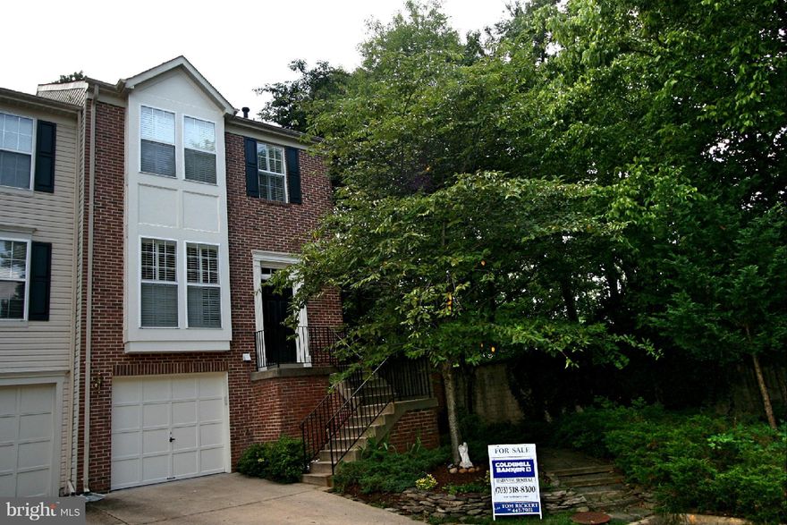 Priced reduced!  Totally upgraded end unit brick garage TH that will not disappoint. Features;Brazilian cherry floors, plantation shutters, luxury baths, updated eat-in kitchen, beautiful crystal chandeliers, walk-out deck w/gas BBQ, LL recreation room w/gas FP and TV w/Bose sound system to convey, front loader W&D, custom moldings, security system, and within walking distance to Huntington Metro!